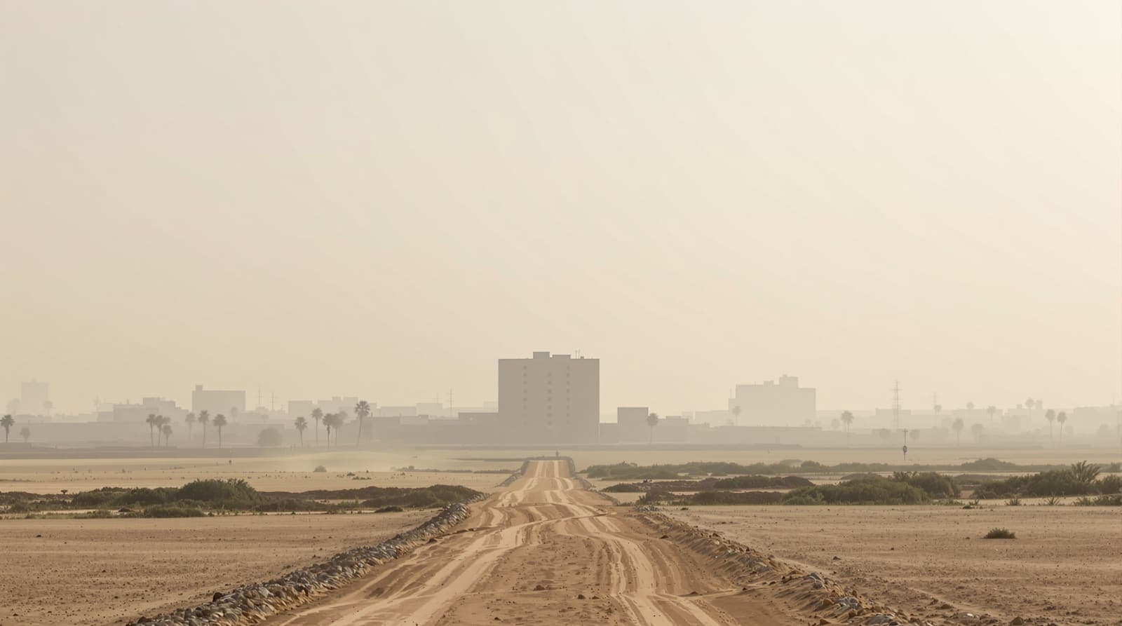 Illustration of the northern Gaza skyline and a pale hospital building seen across sandy open ground at hazy dawn.
