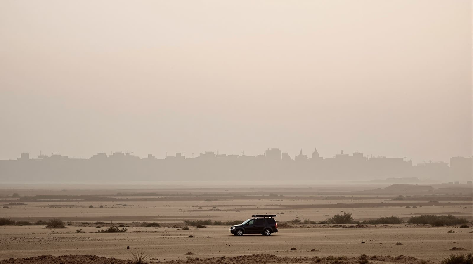 Illustration of the hazy Khan Younis skyline in southern Gaza seen from distant farmland at dawn