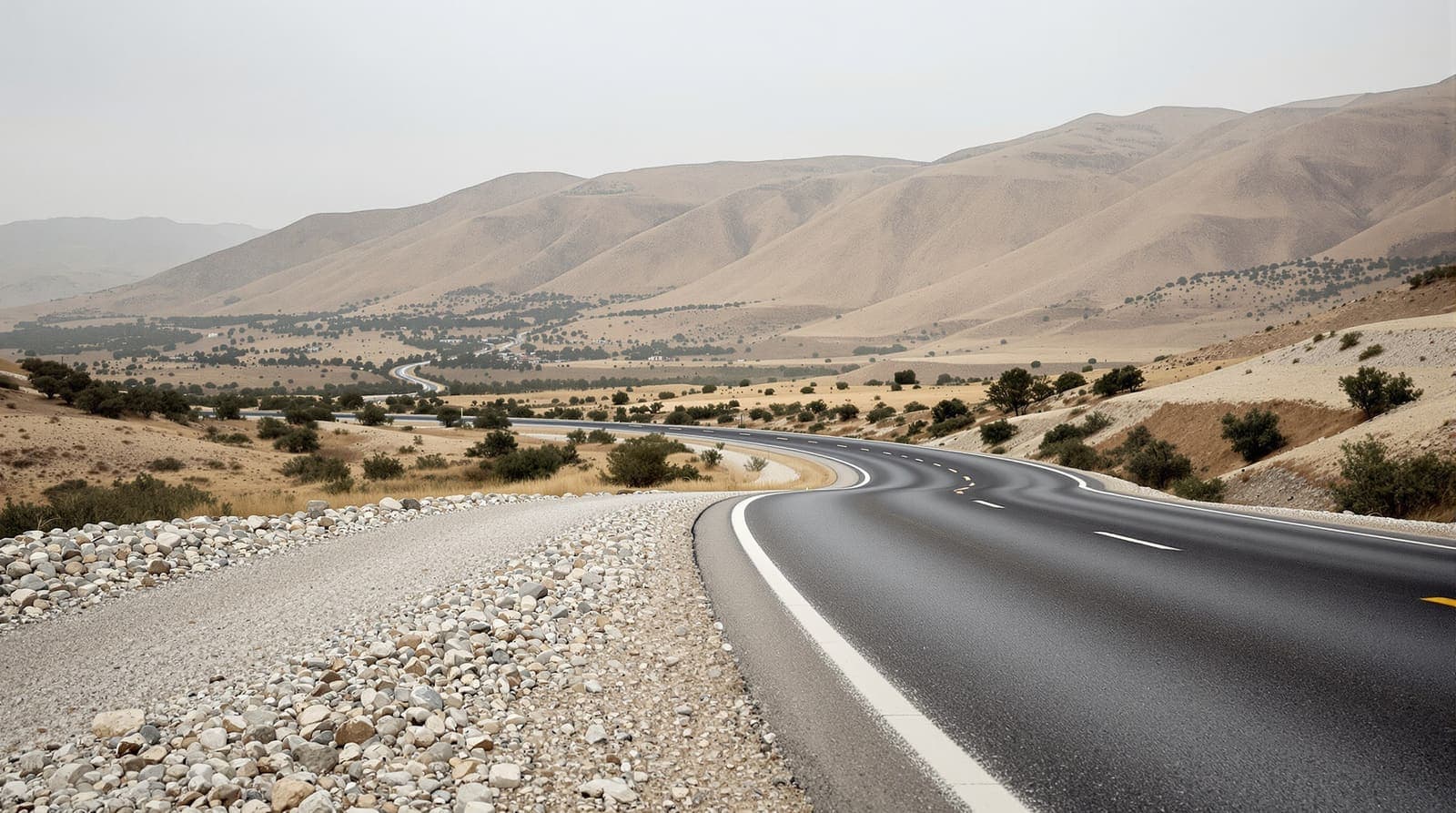 Illustration of an empty highway curving through terraced limestone hills in the northern West Bank at dawn.