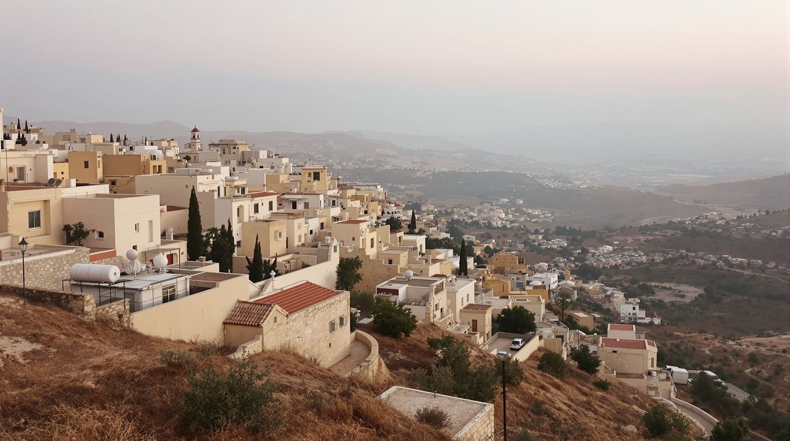 Illustration of a quiet stone hillside town amid olive terraces in the northern West Bank at dawn, empty lanes under soft grey light.