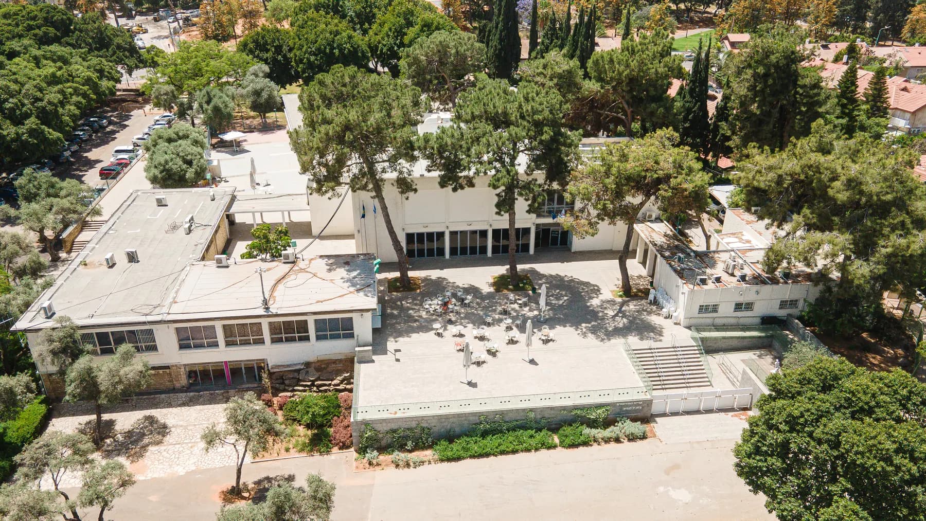 The museum compound in Petah Tikva seen from above, its low buildings among trees