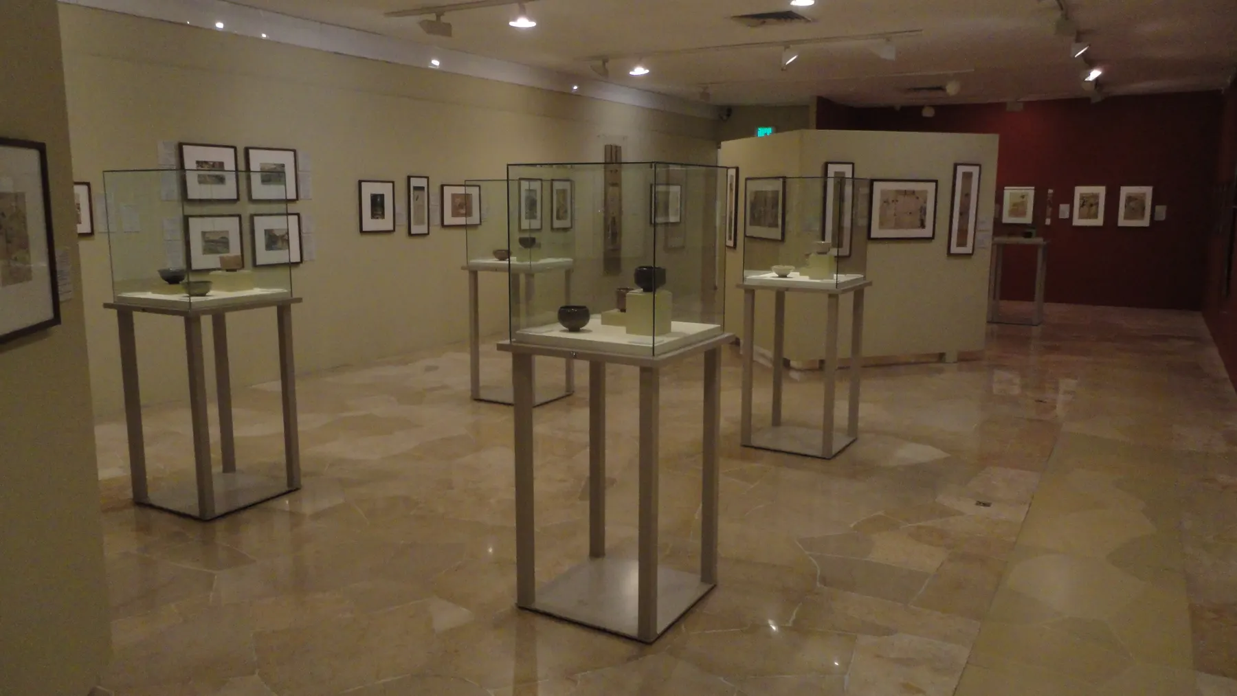 A gallery of the Tikotin Museum, framed Japanese prints on the walls and display cases in the middle