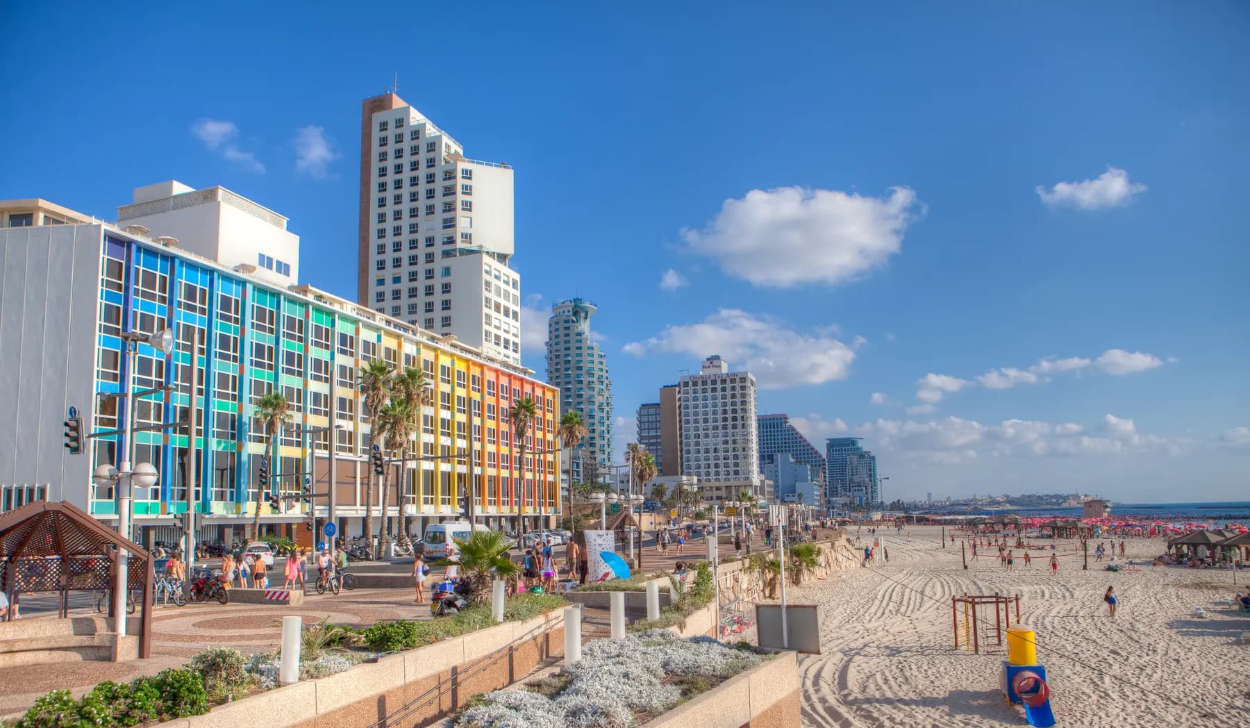 The Tel Aviv promenade and beach, with hotels and towers along the seafront