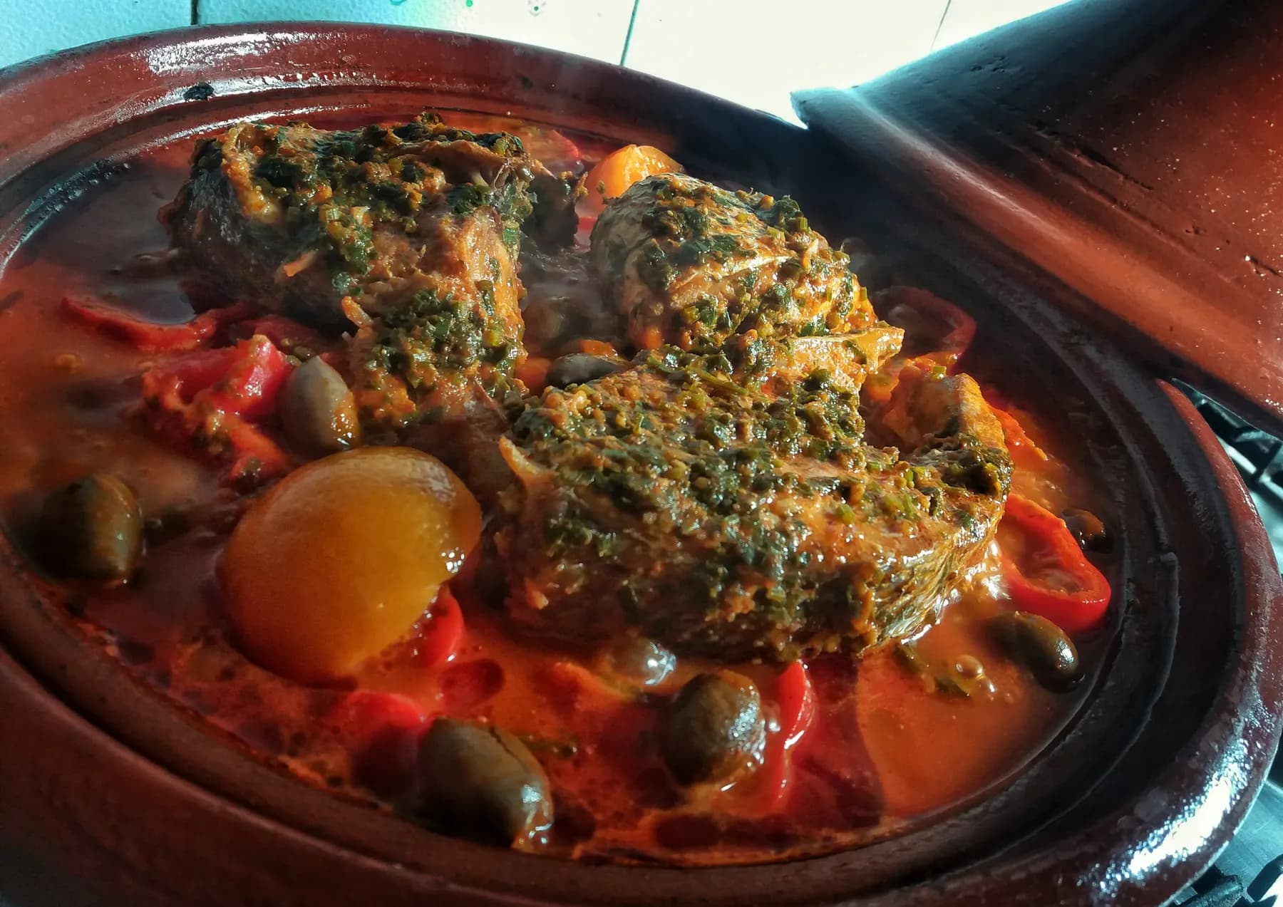 Fish cooked in a spicy red sauce with olives, the North African way