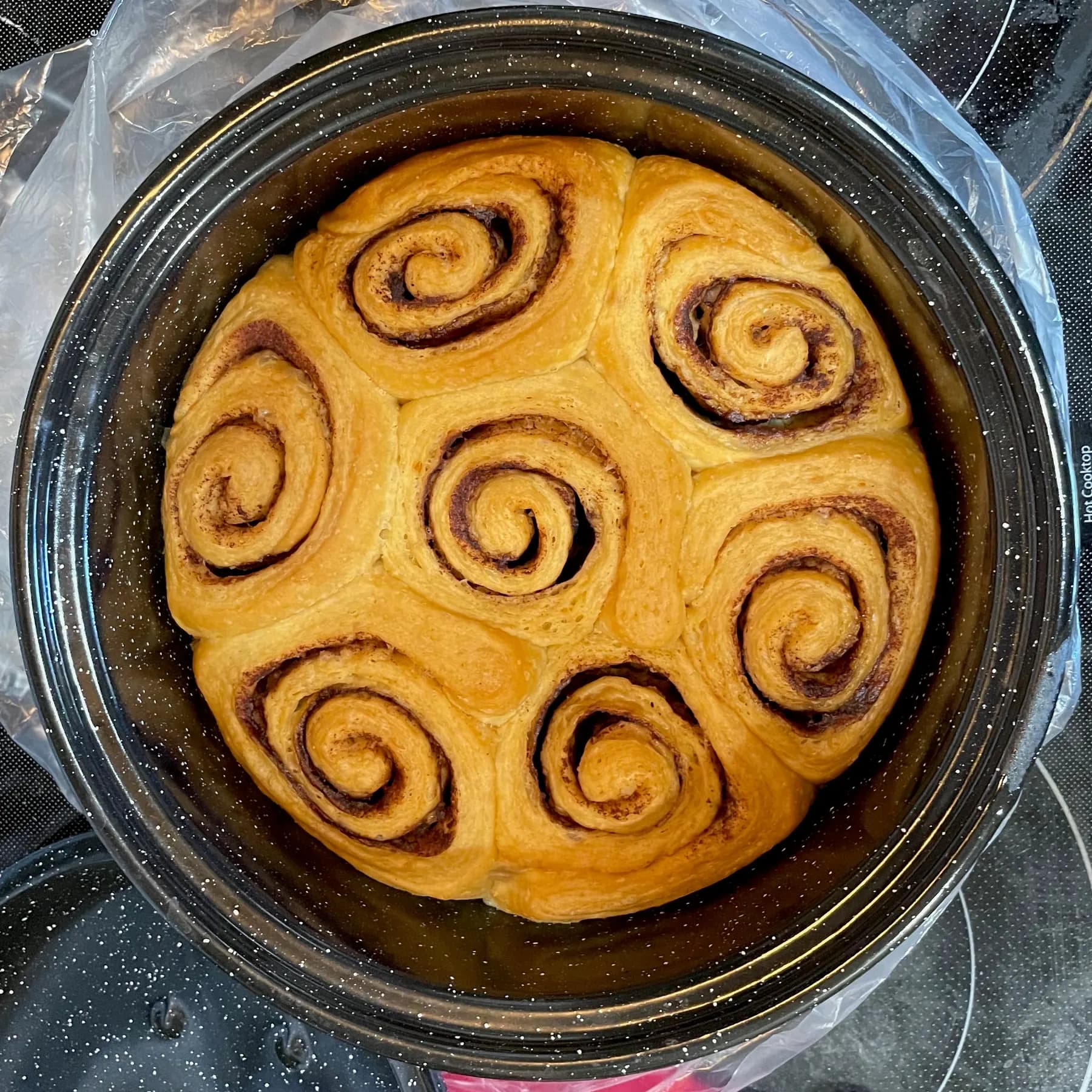 A pan of cinnamon buns, fresh from the oven