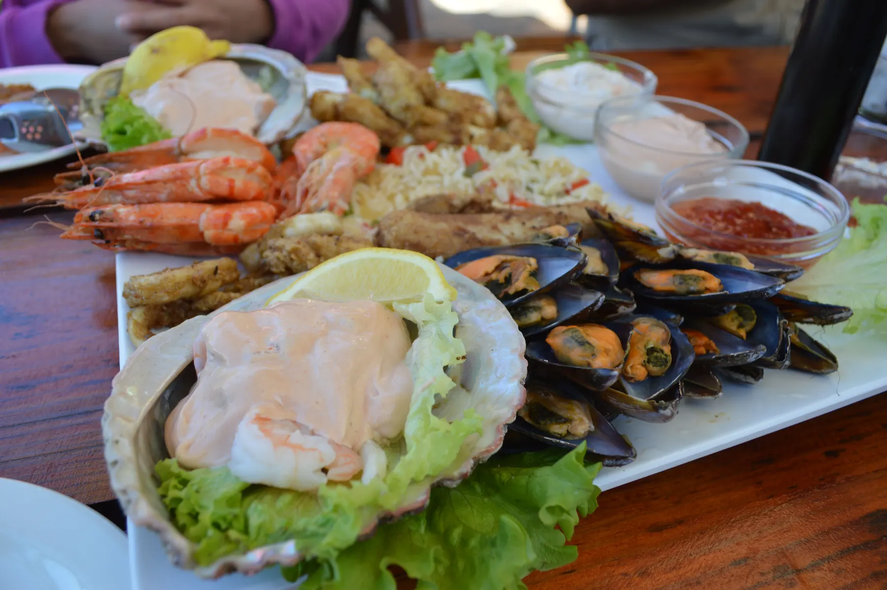 A seafood platter with prawns, mussels and fried squid