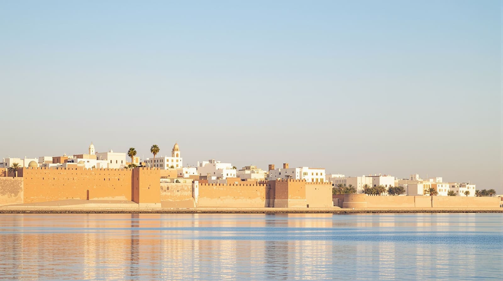 Illustration of Rabat's Kasbah walls and city skyline across the calm Bou Regreg river in soft morning light.