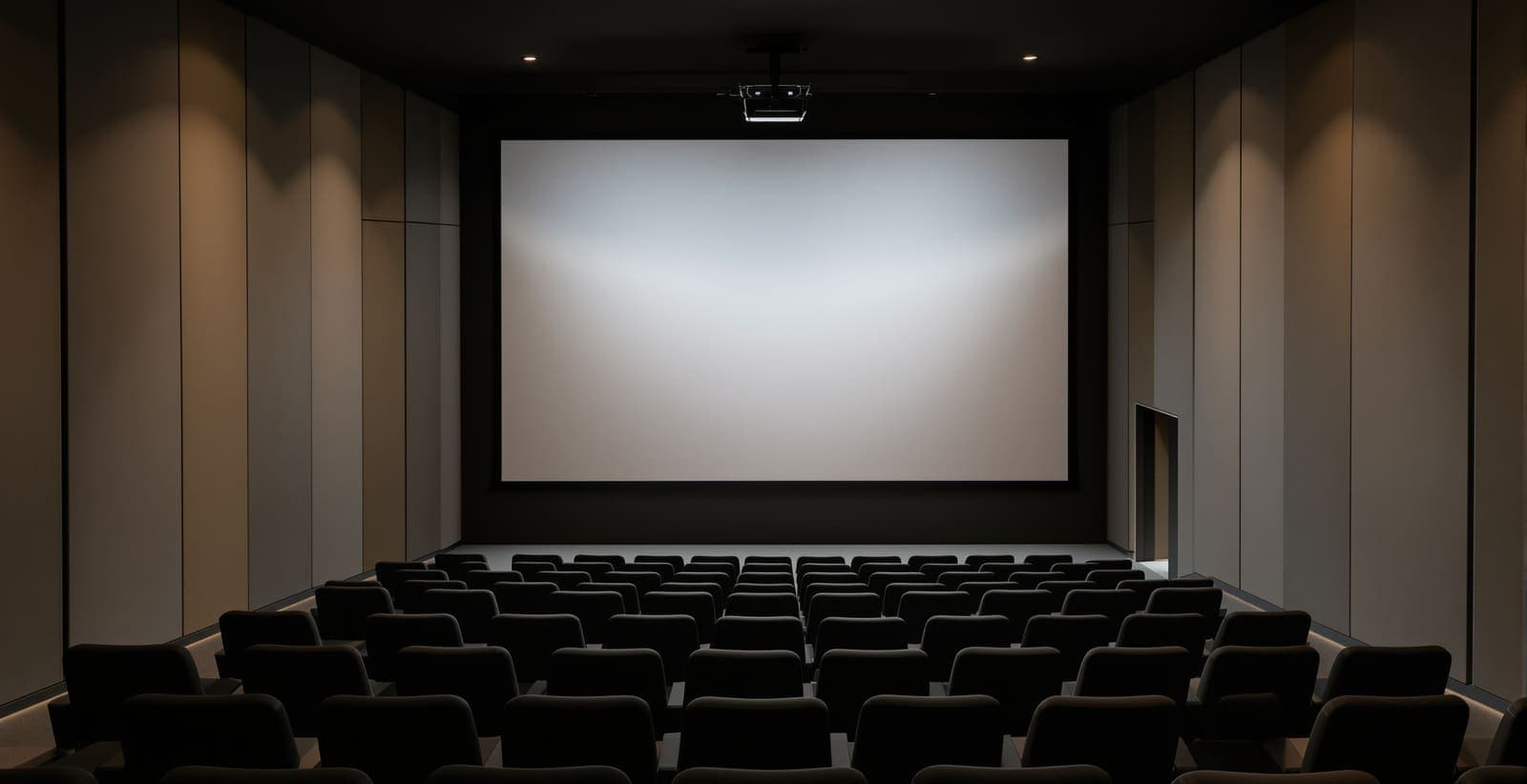Illustration of an empty screening room with rows of seats and a projector beam drifting above them.