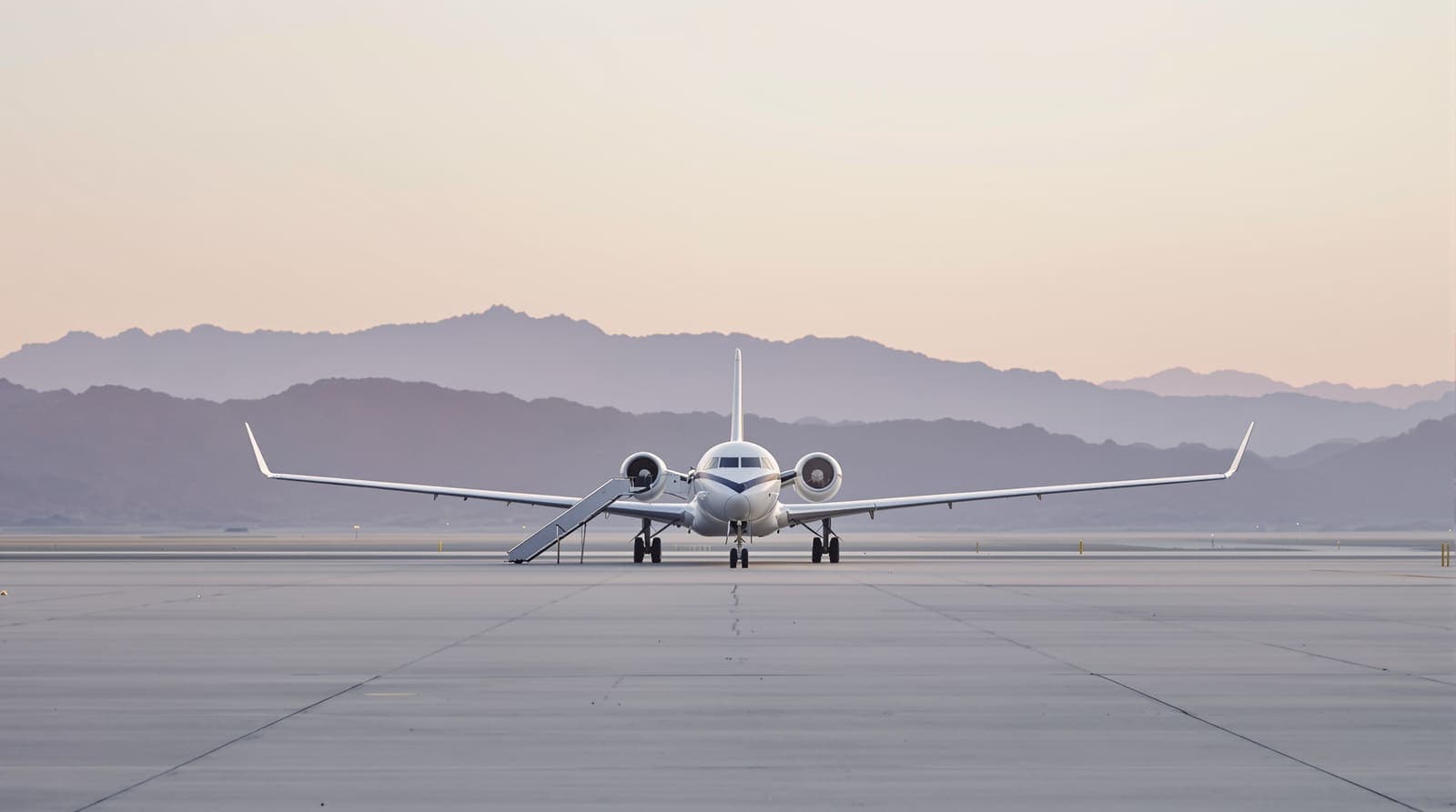 Illustration of a white passenger jet parked on an empty desert airport apron at dawn with hazy mountains behind