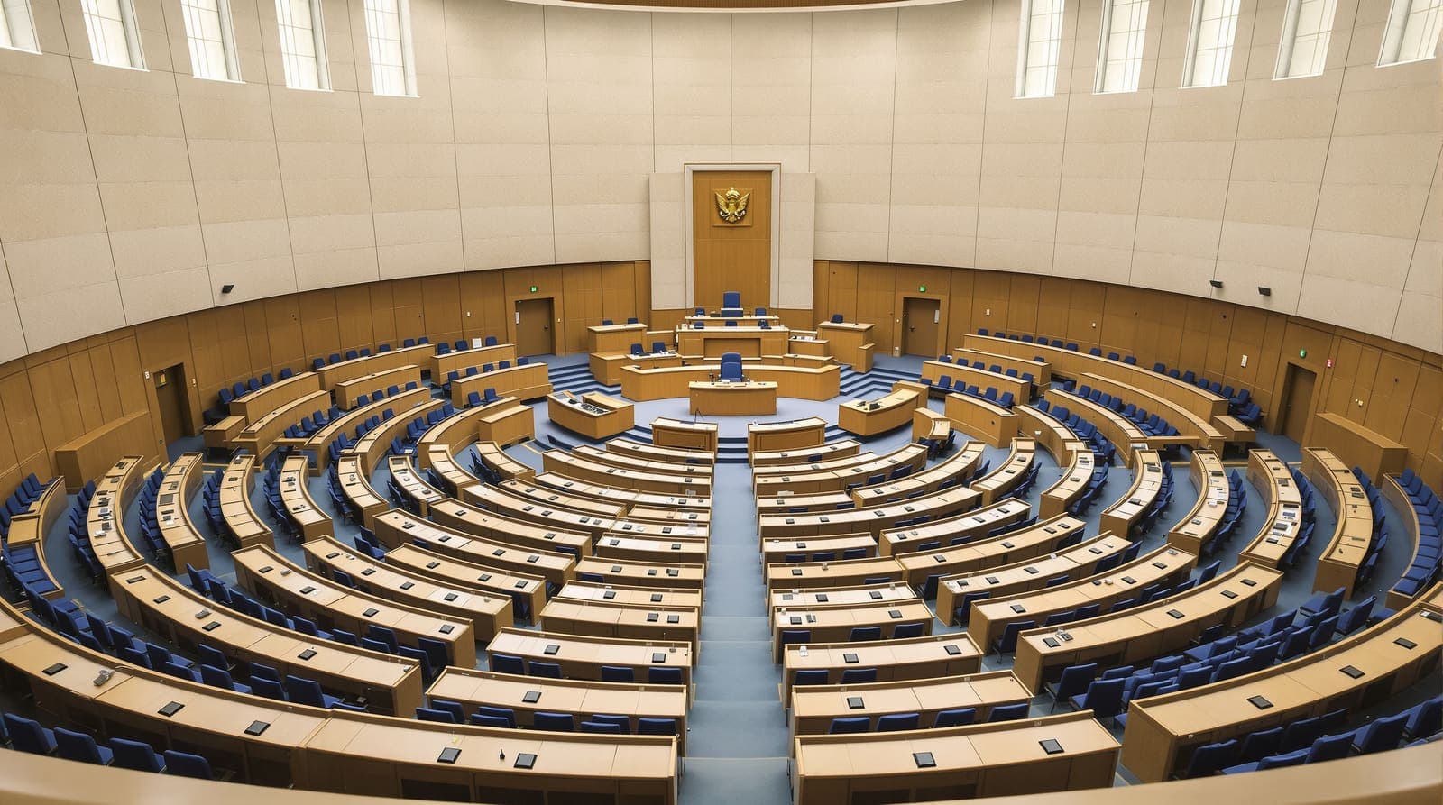 Illustration of an empty parliamentary chamber with curved rows of vacant seats seen from the public gallery in soft daylight.