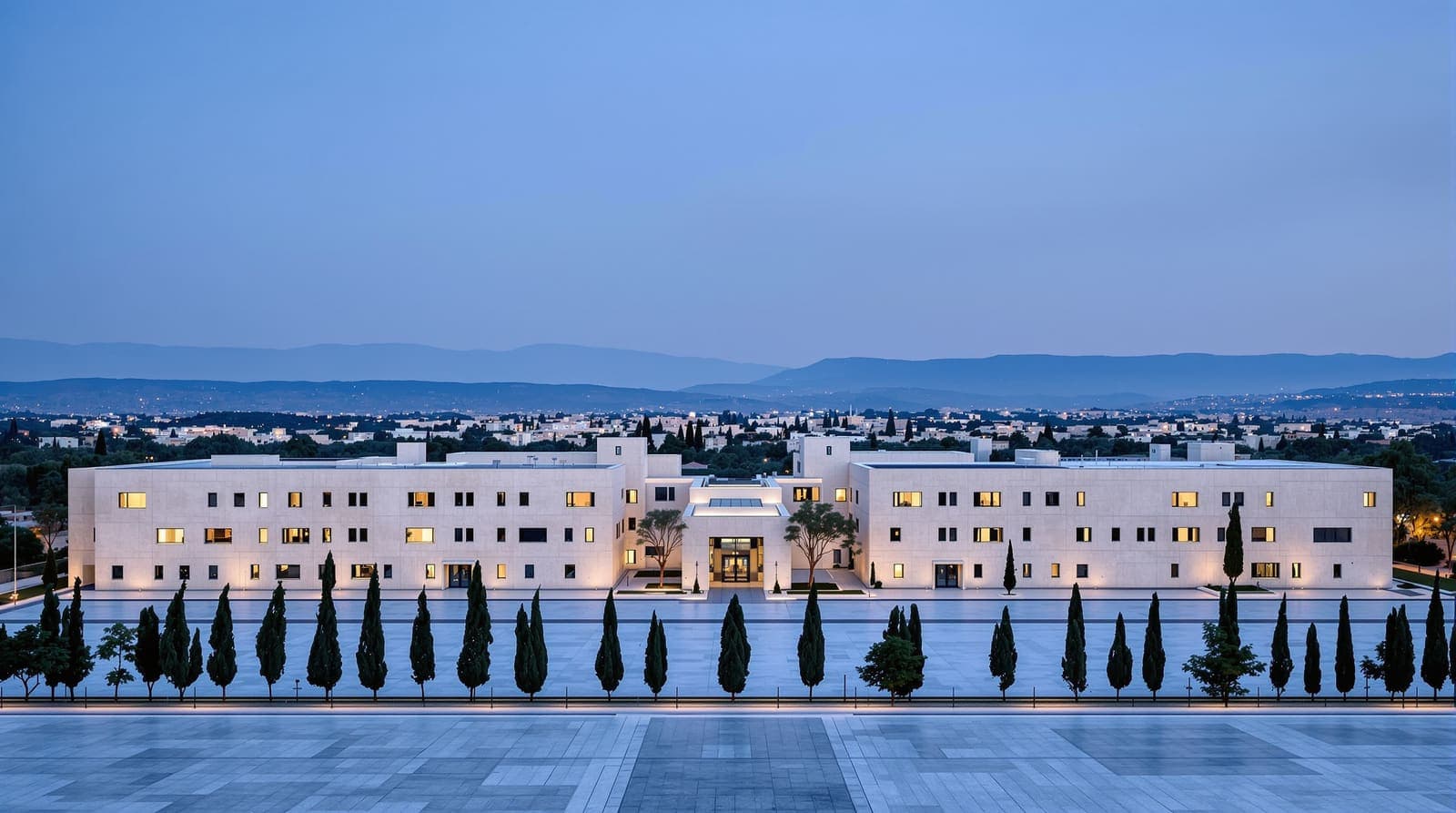 Illustration of limestone government office buildings in Jerusalem at dusk, with an empty plaza, cypress trees and hazy hills beyond.