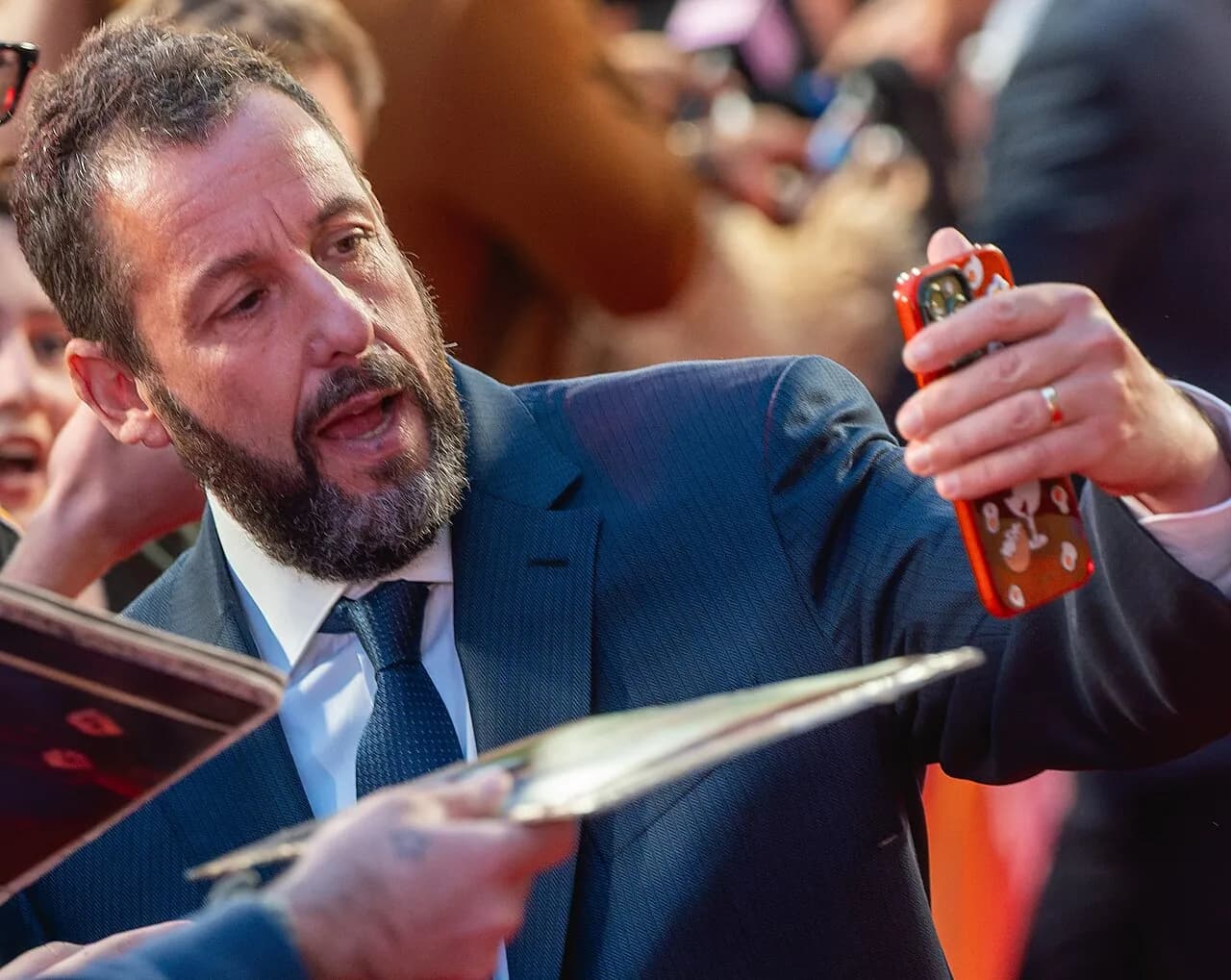 Adam Sandler with fans on the red carpet at the London premiere of Jay Kelly, 2025
