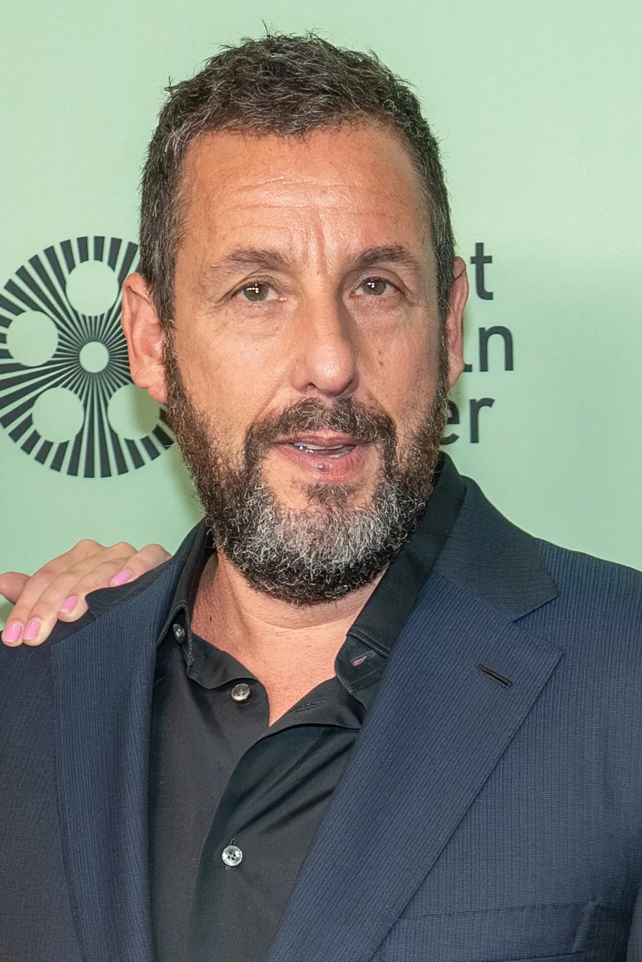 Adam Sandler in a navy jacket at the New York Film Festival, 2025