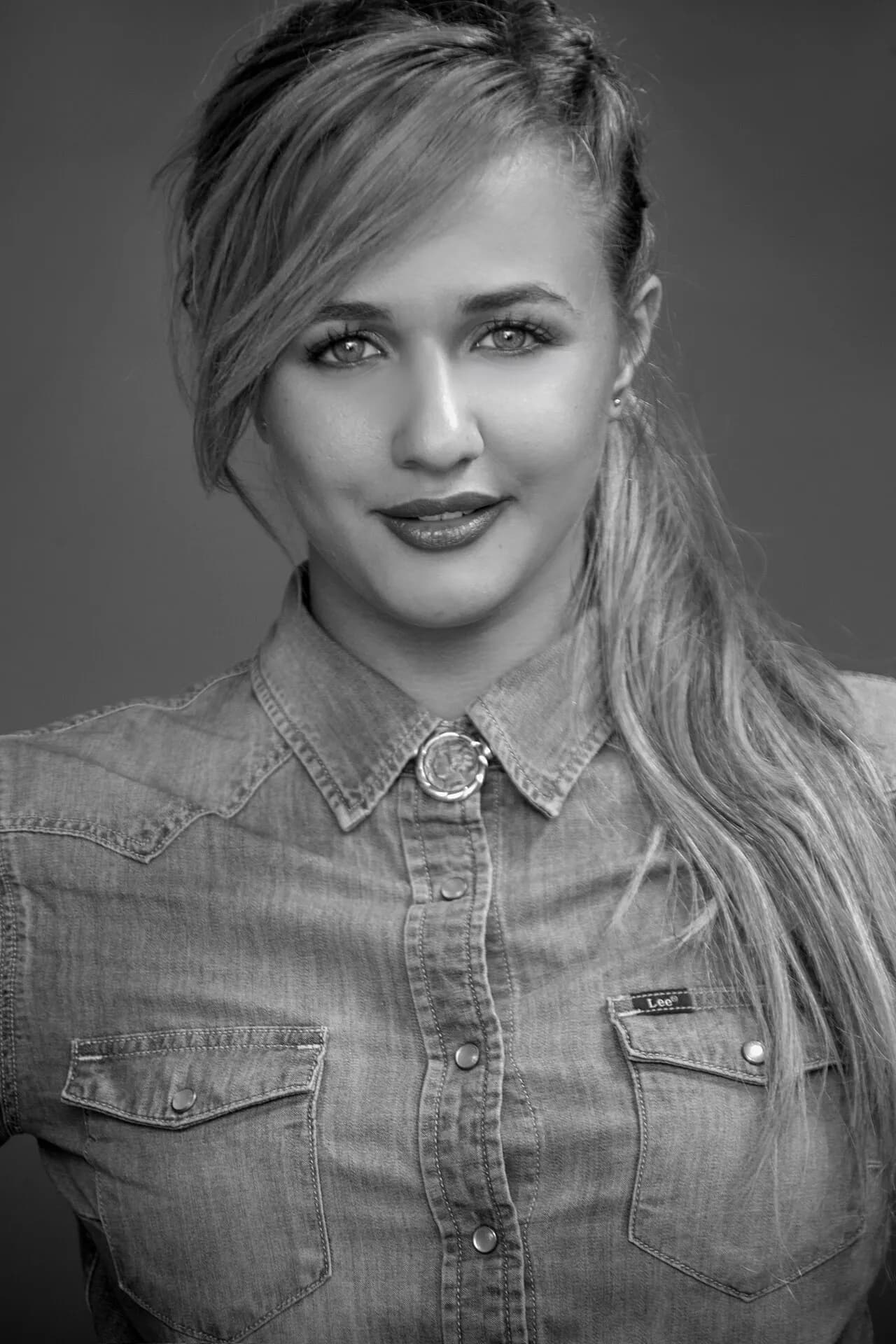 Black and white portrait of Eden Ben Zaken in a denim shirt, 2015