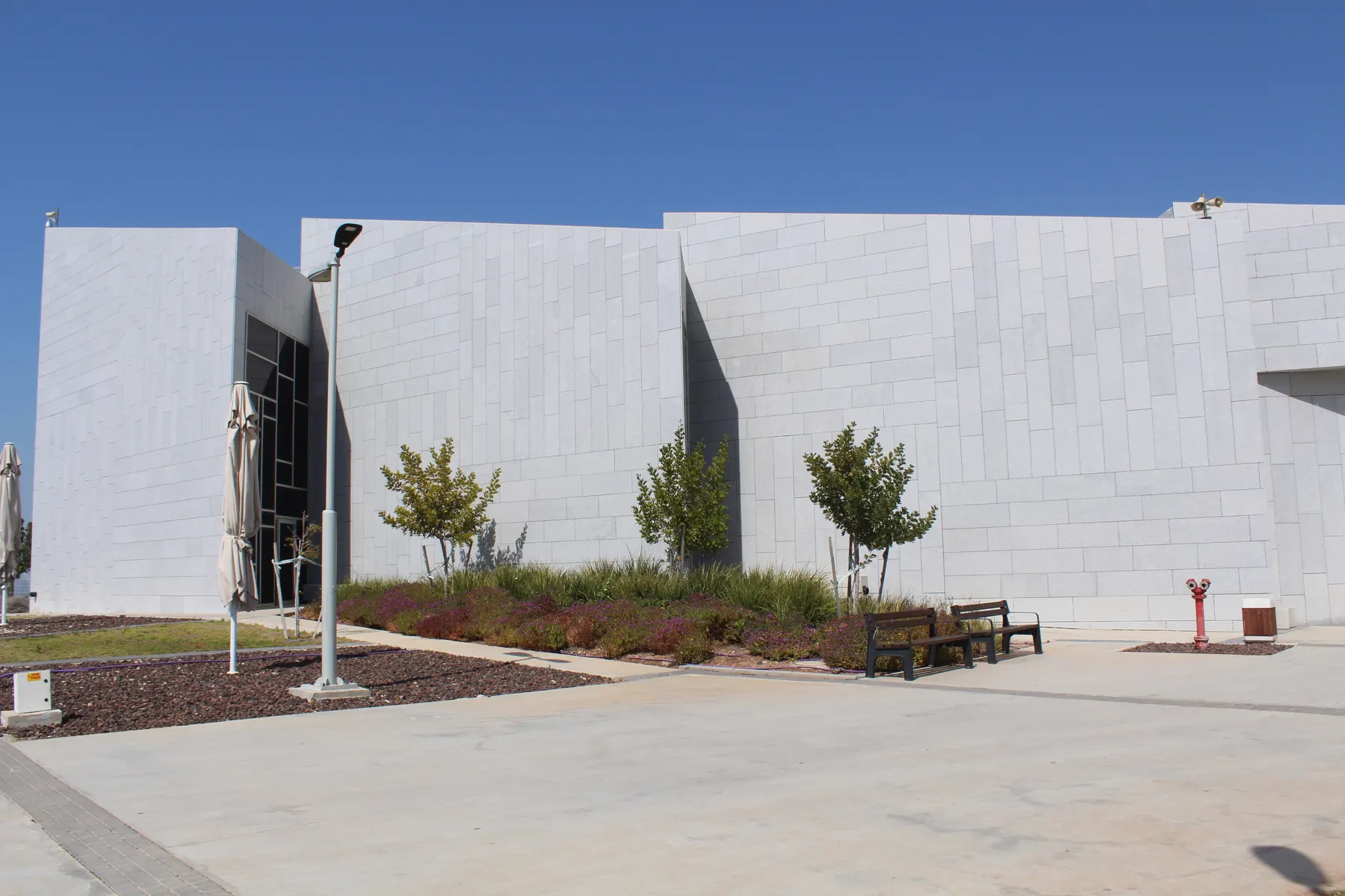 The white walls and the front plaza of the Israel Police Heritage Center