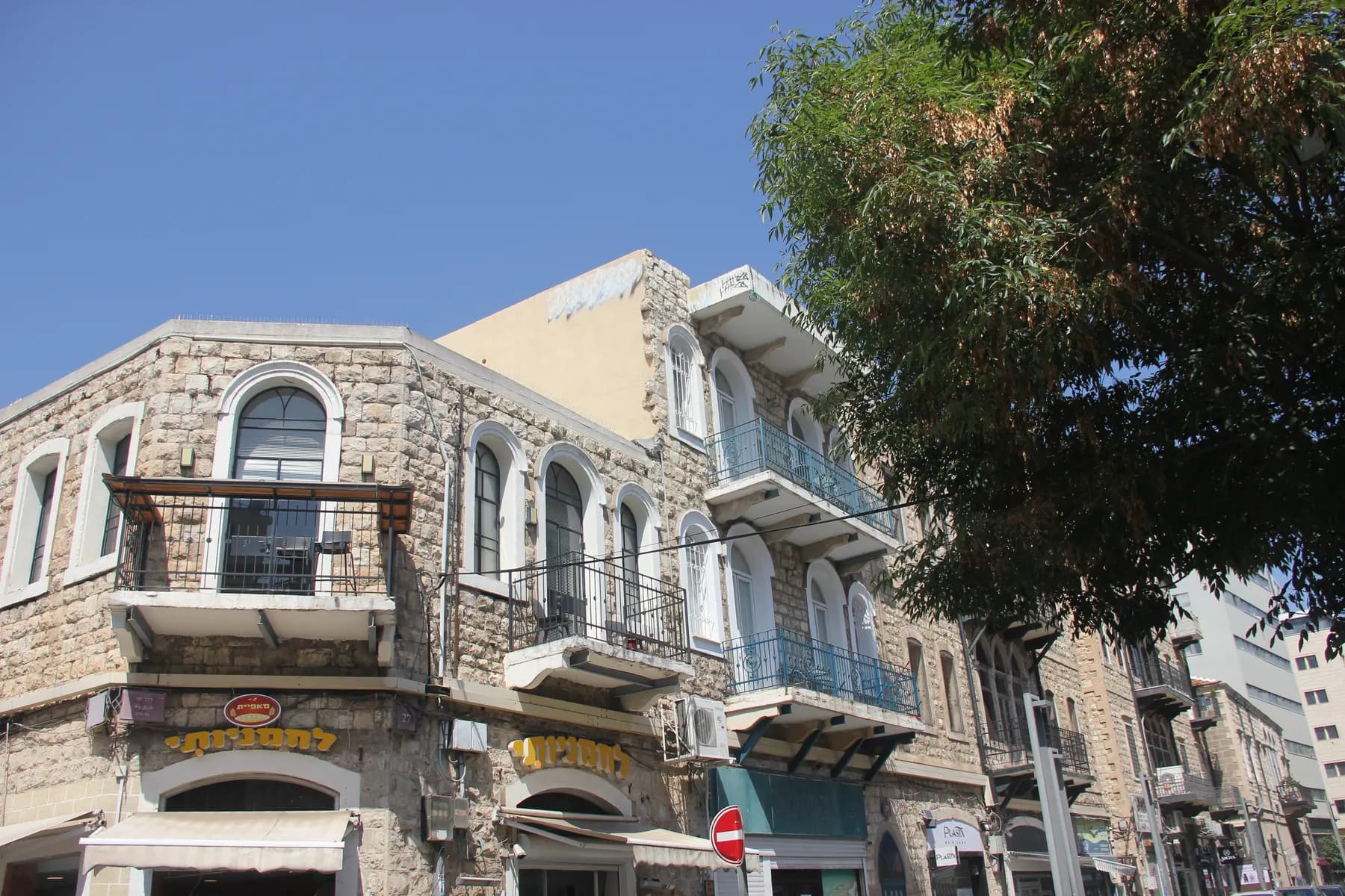 A stone house with a balcony in Wadi Nisnas, Haifa
