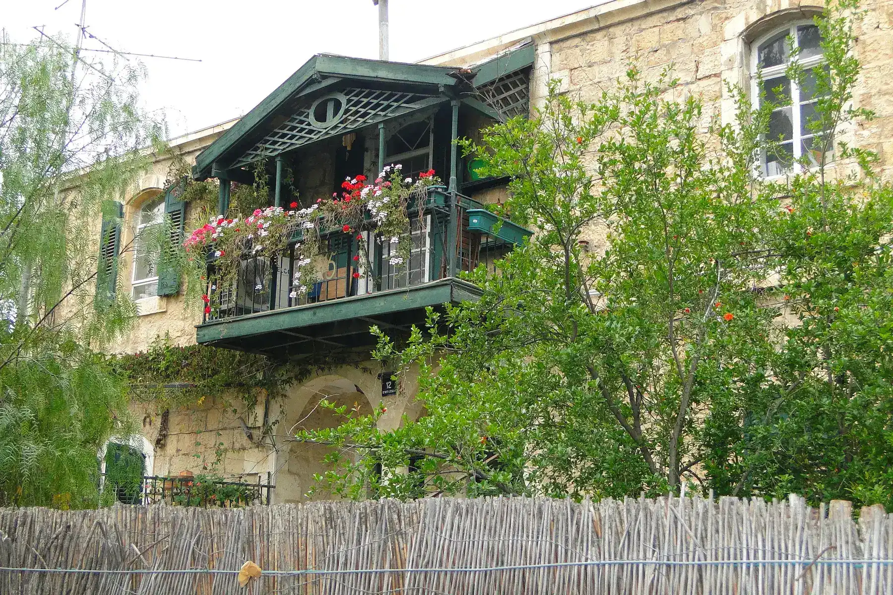 A Templer house with a balcony of flowers in Jerusalem's German Colony