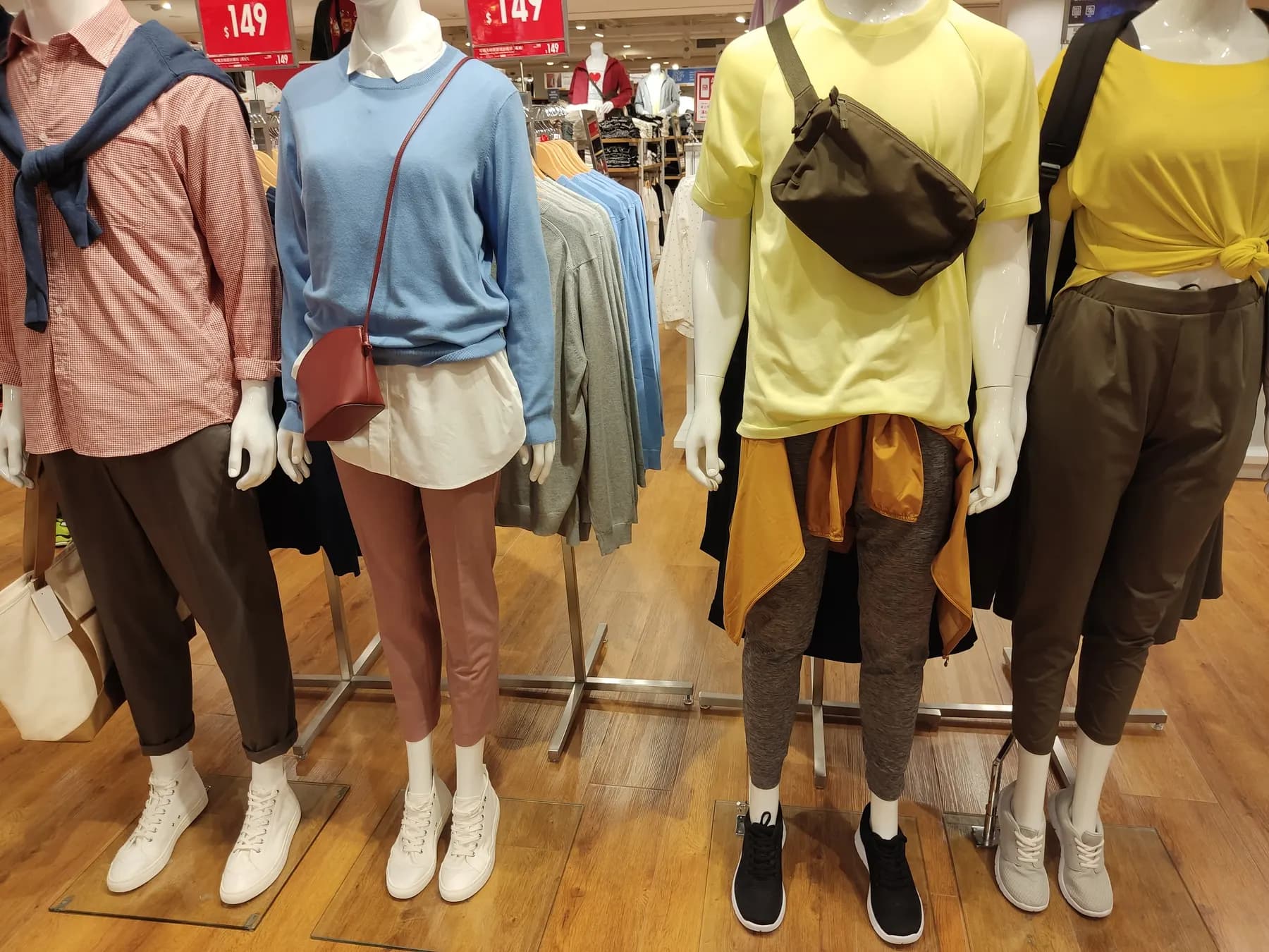 Mannequins in casual clothes in a clothing shop.
