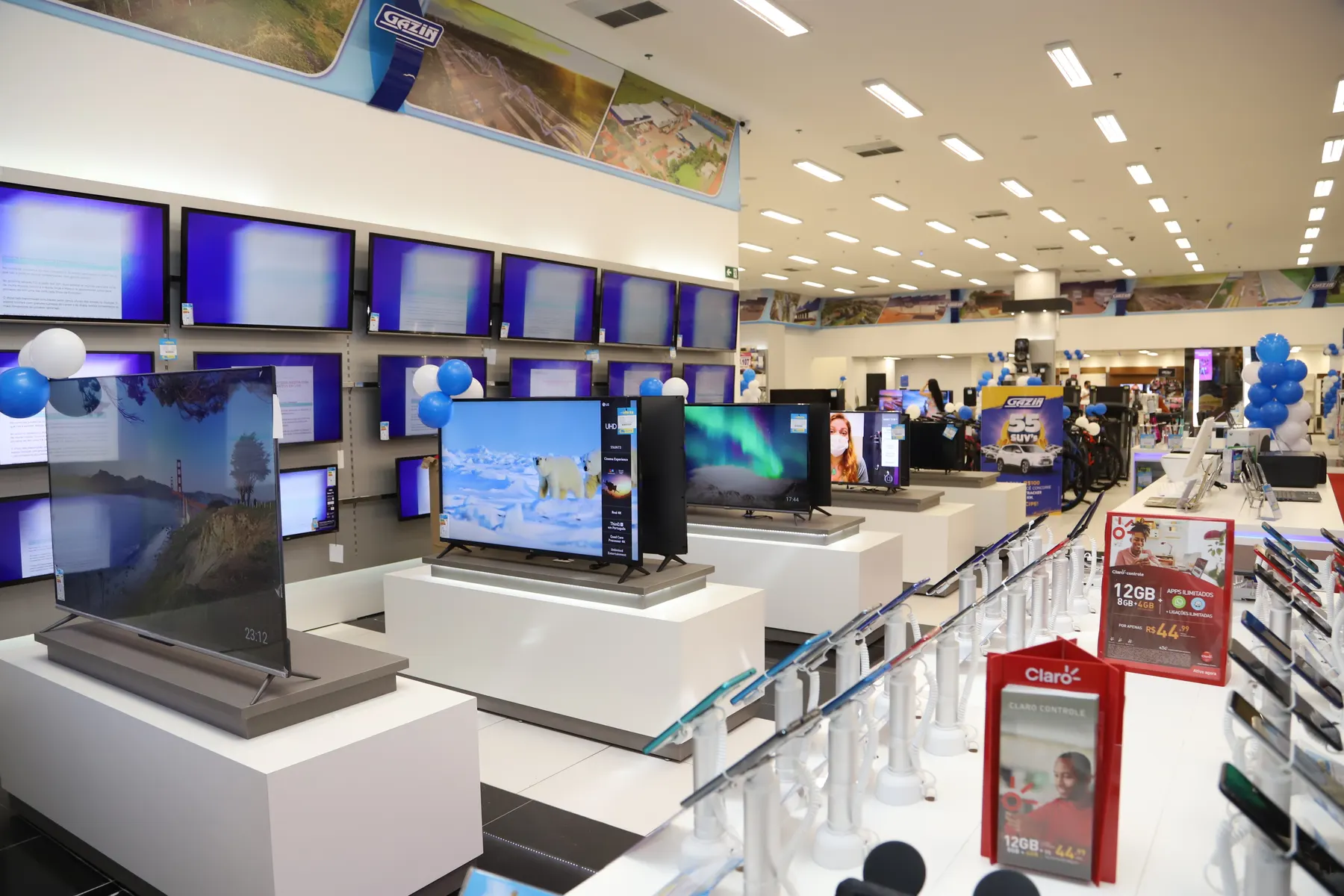Televisions on display in an electronics shop.