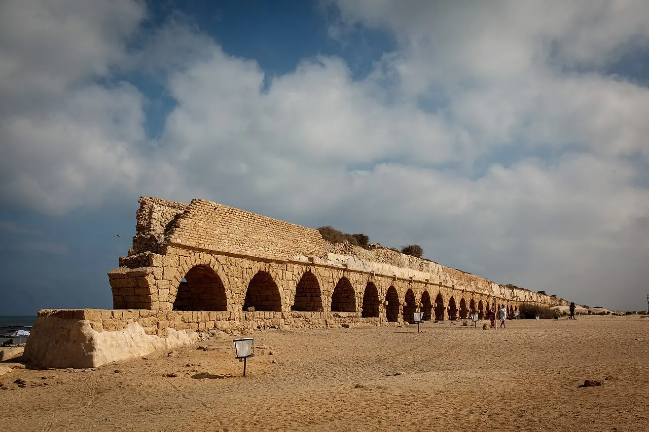 The Roman aqueduct's arcade running along the sand at Aqueduct Beach, Caesarea