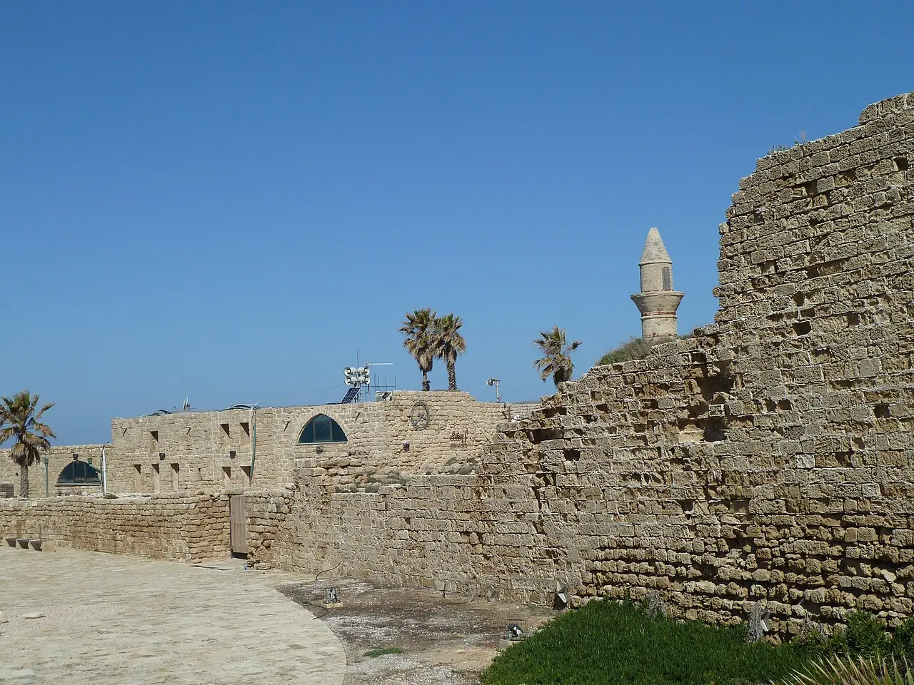 Caesarea's Crusader-period wall with the harbour mosque's minaret beyond it