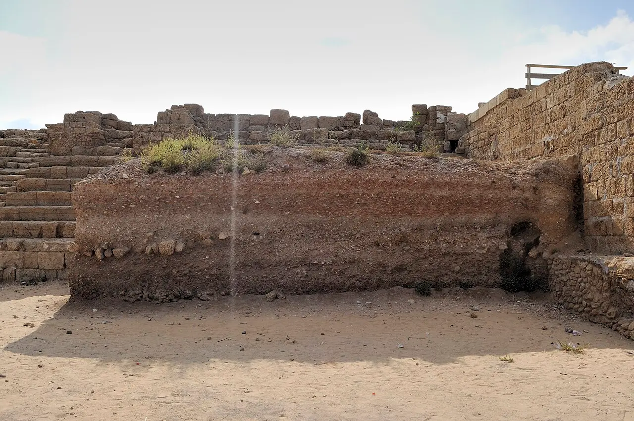 Rows of stone seating and a retaining wall at Herod's hippodrome, Caesarea