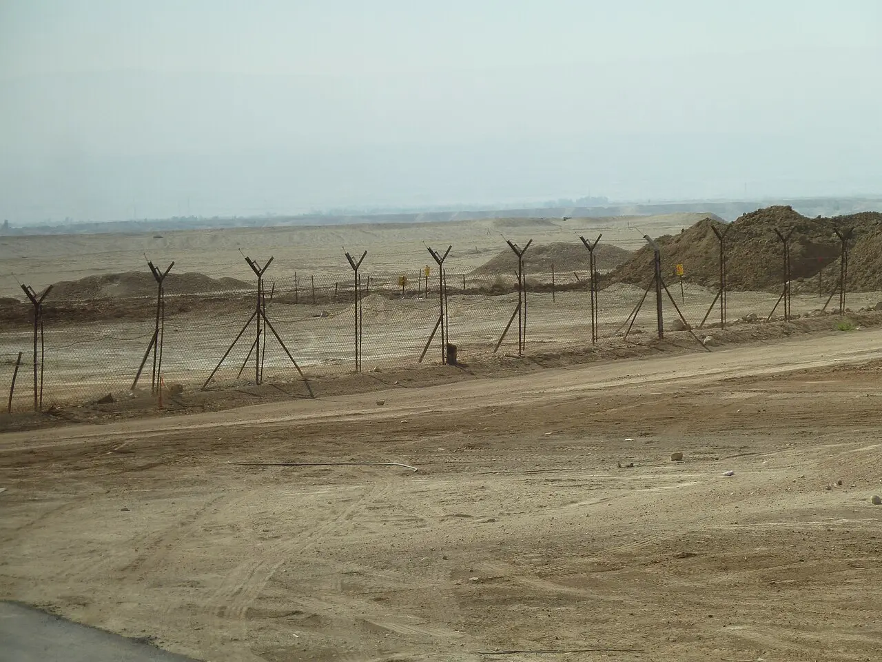 A barbed-wire fence along the road to Qasr al-Yahud