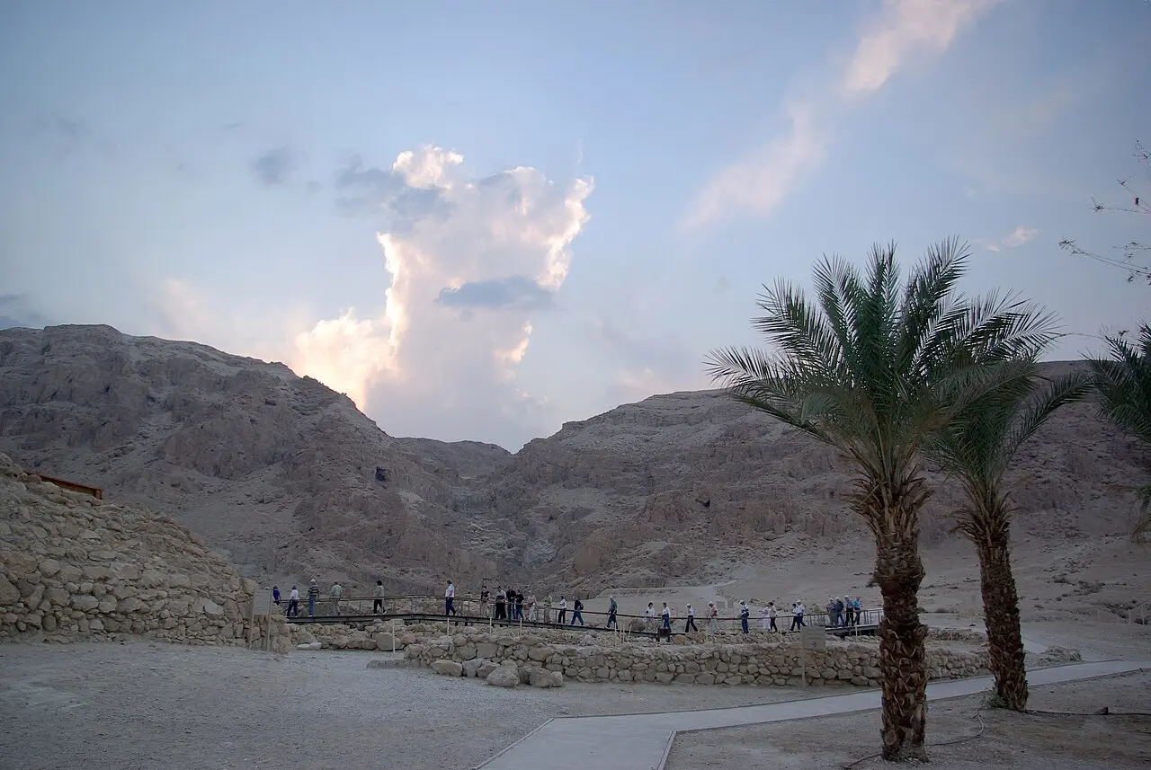 Visitors on the walkways at Qumran, below the cliffs of the Judean Desert