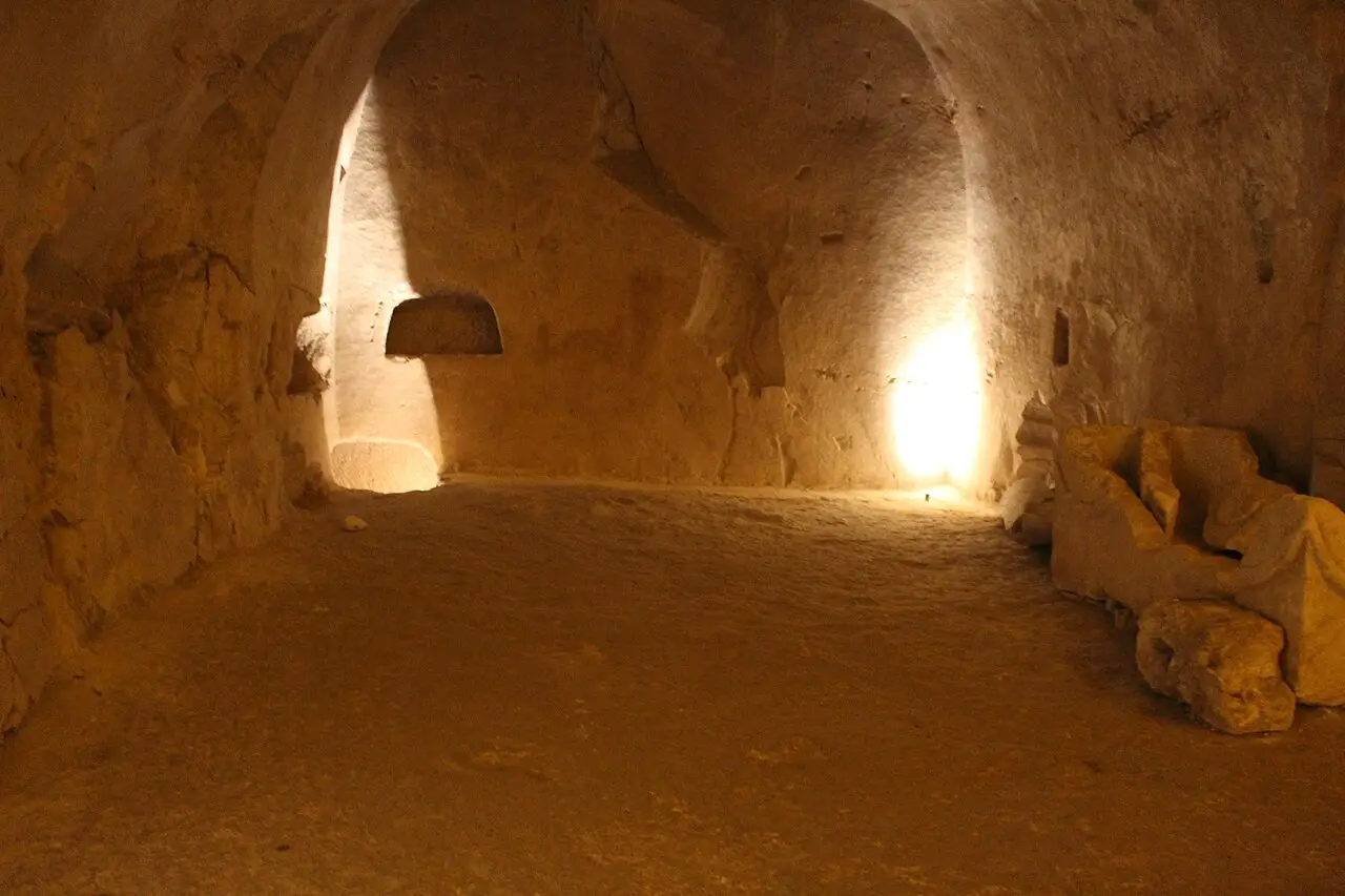 A burial chamber in Catacomb 20 at Beit She'arim, lit from its side rooms