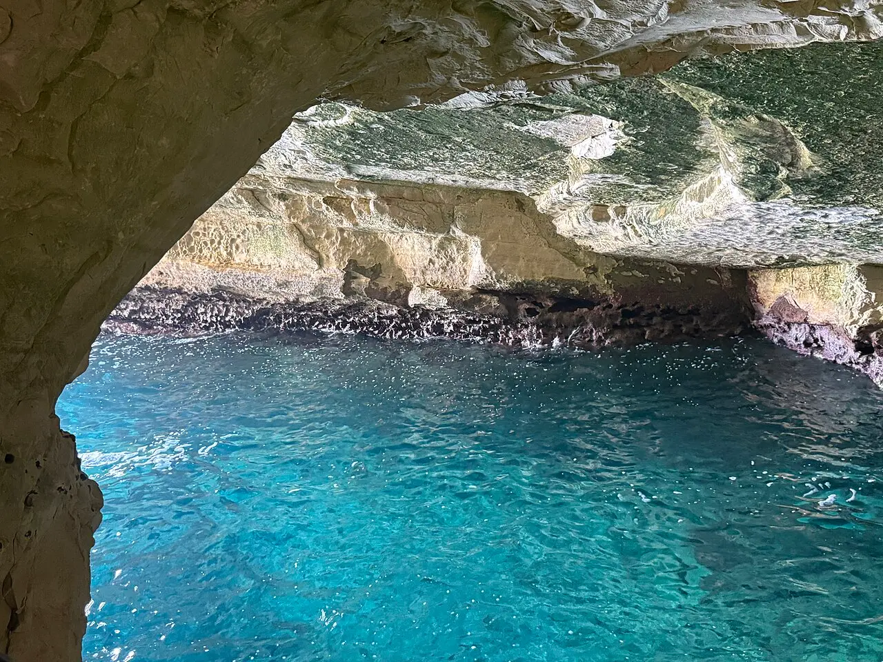 Turquoise water inside a sea grotto at Rosh Hanikra, seen from the observation tunnel