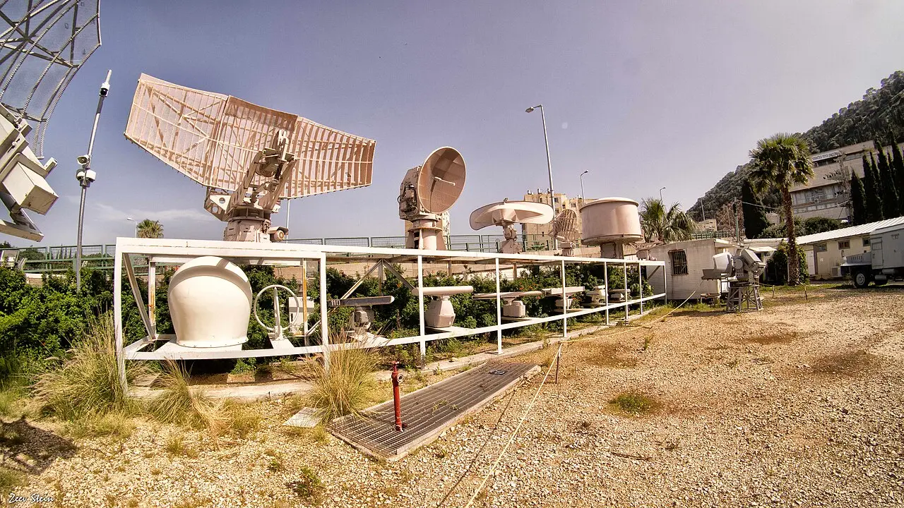 Naval radar dishes and equipment in the museum's open-air yard in Haifa