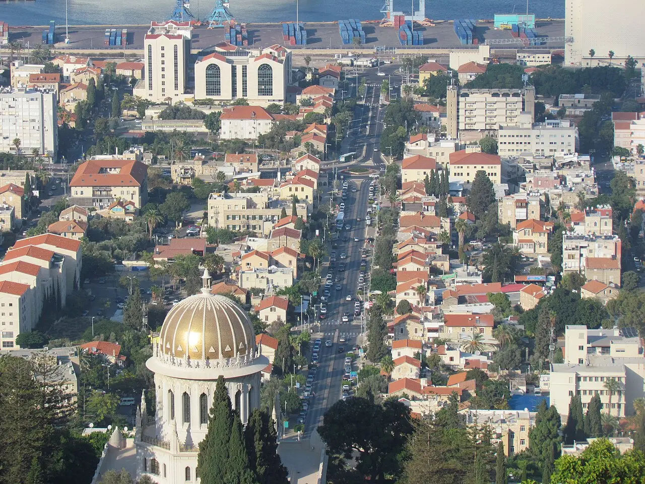The German Colony's main street running from the foot of the terraces toward the port, the shrine's dome in the foreground