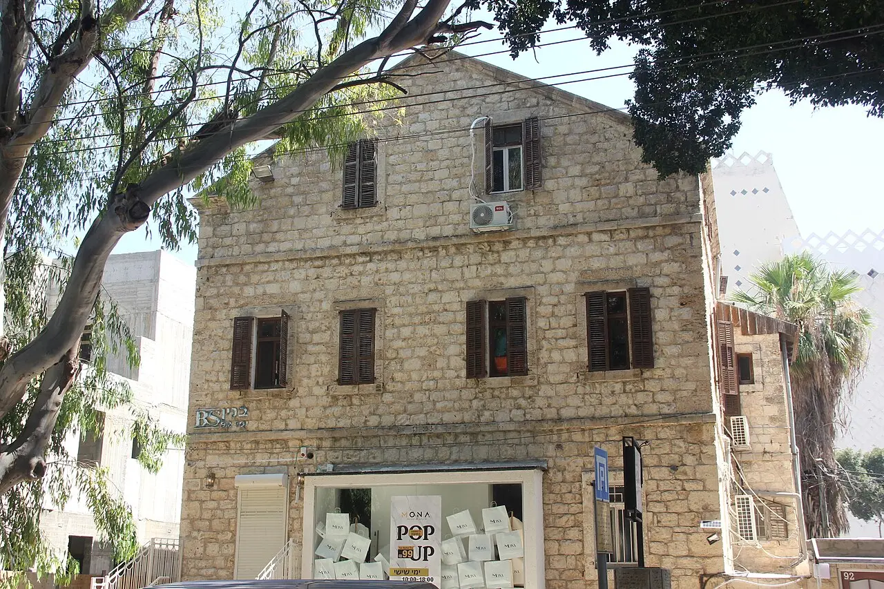 An old stone house on a street in Wadi Nisnas, Haifa