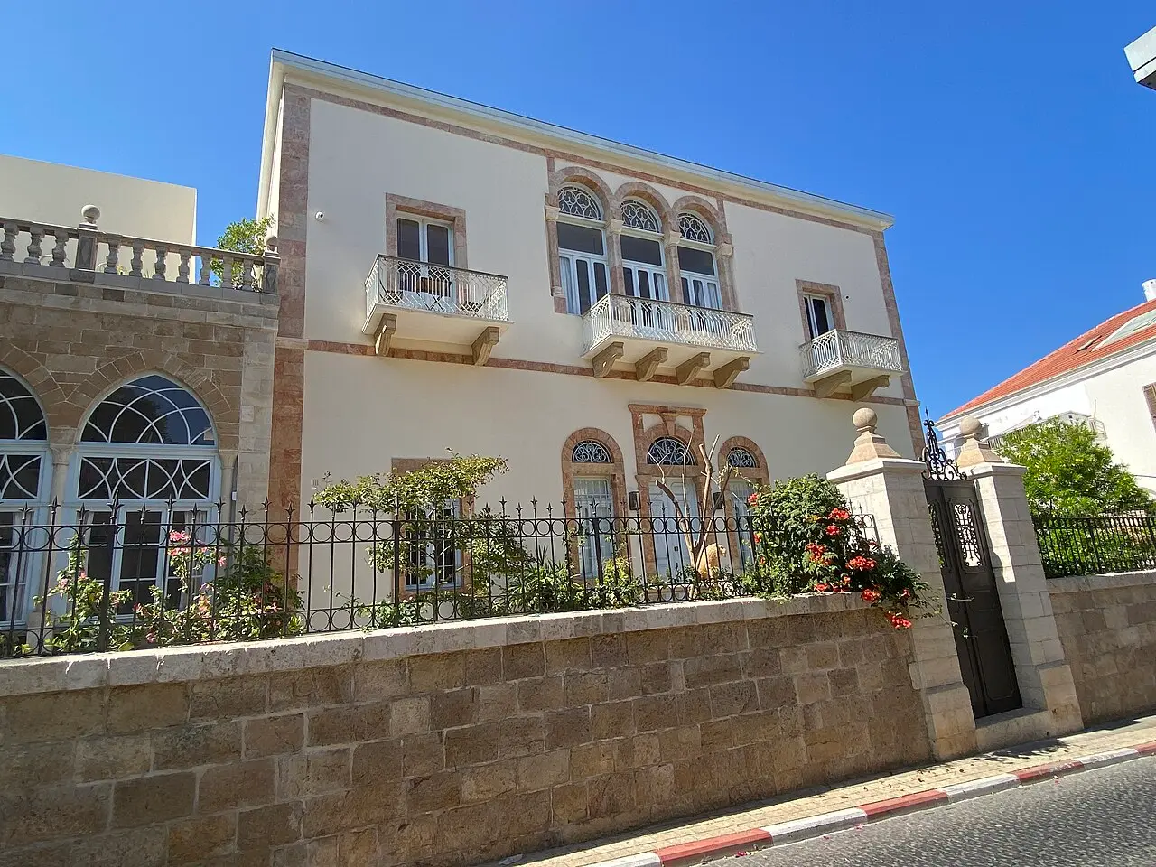 A restored stone villa with arched windows and a balcony in Ajami, Jaffa