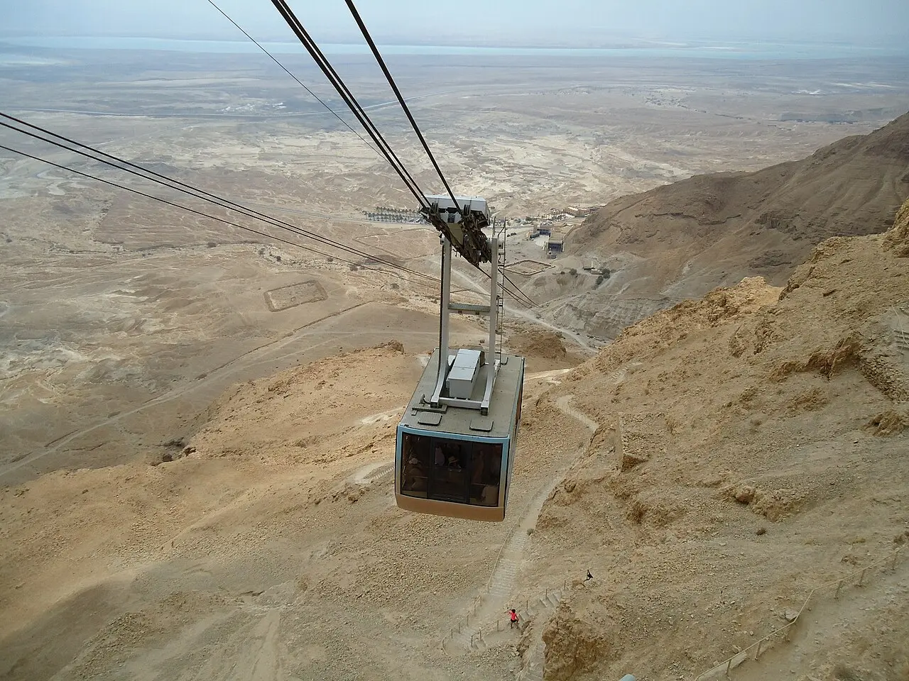A cabin of the Masada cable car far above the dry wadis