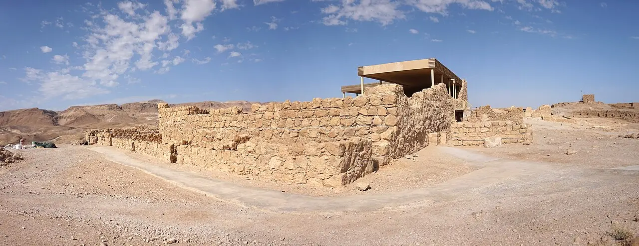 The walls of the Western Palace on Masada, a modern roof sheltering part of it