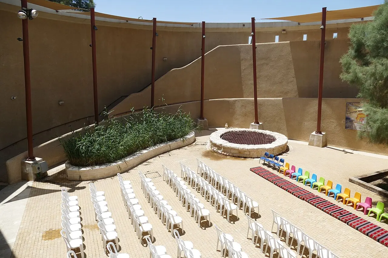 The courtyard at Abraham's Well set out with chairs, the well at its centre