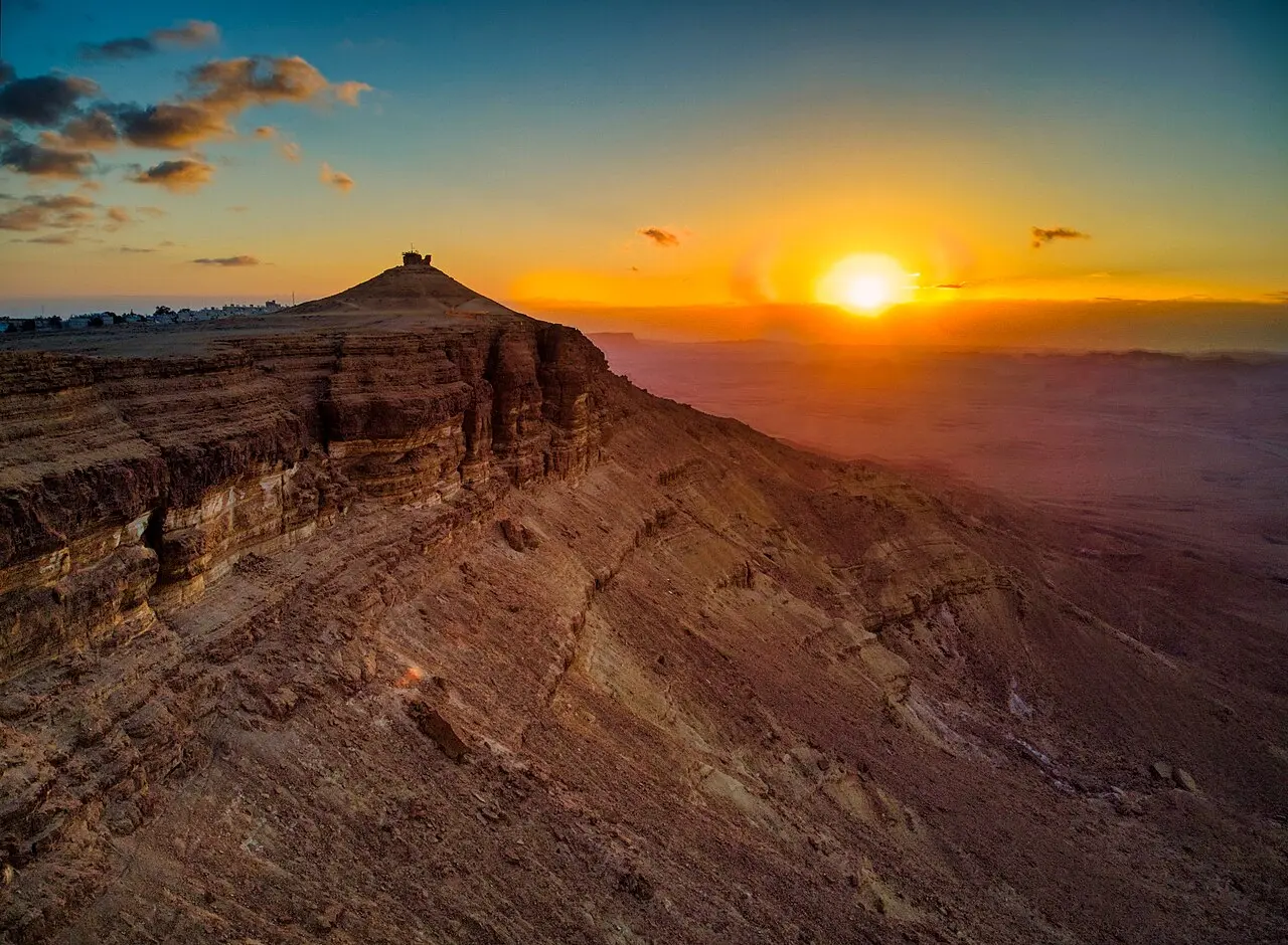 The sun low over Makhtesh Ramon, seen from Camel Hill at Mitzpe Ramon