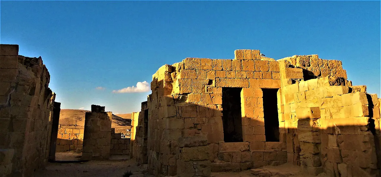 A two-storey stone building with tall doorways at Mamshit