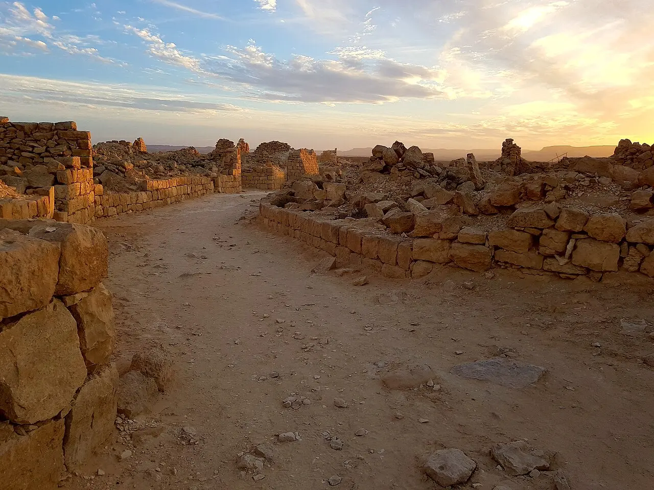 A lane through the ruins of Shivta at sunset