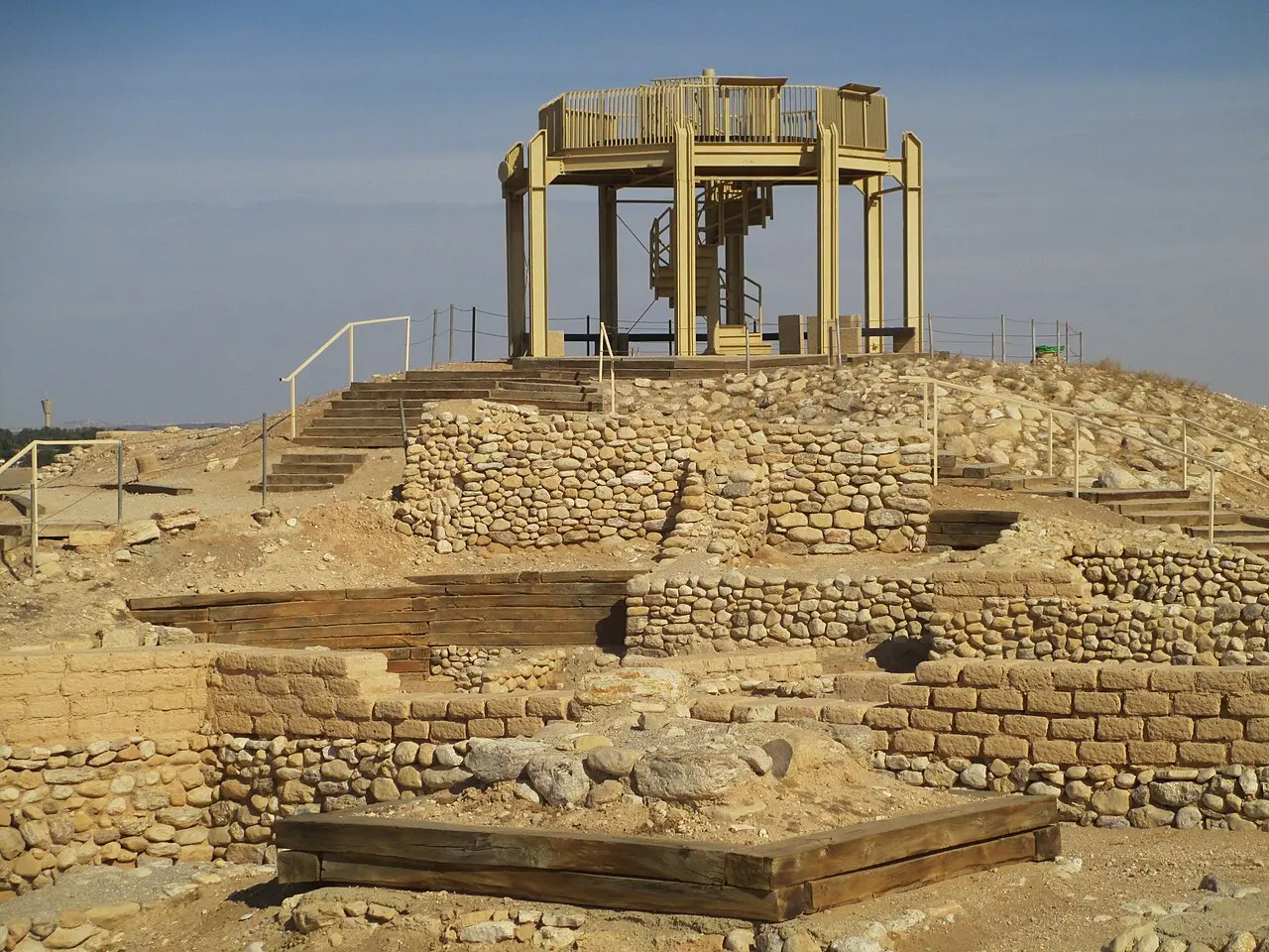 The lookout tower rising above the excavated walls of Tel Be'er Sheva