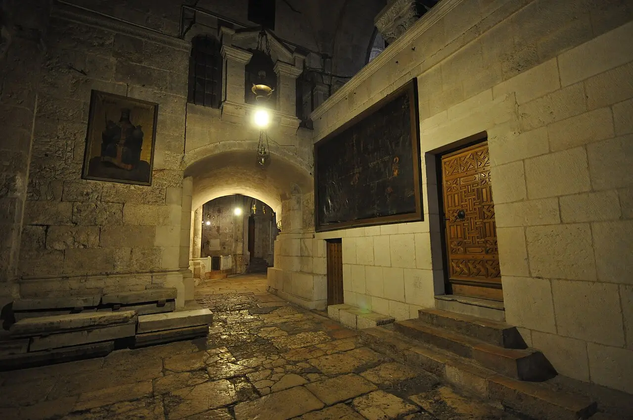 A lamp-lit stone passage at the Church of the Holy Sepulchre