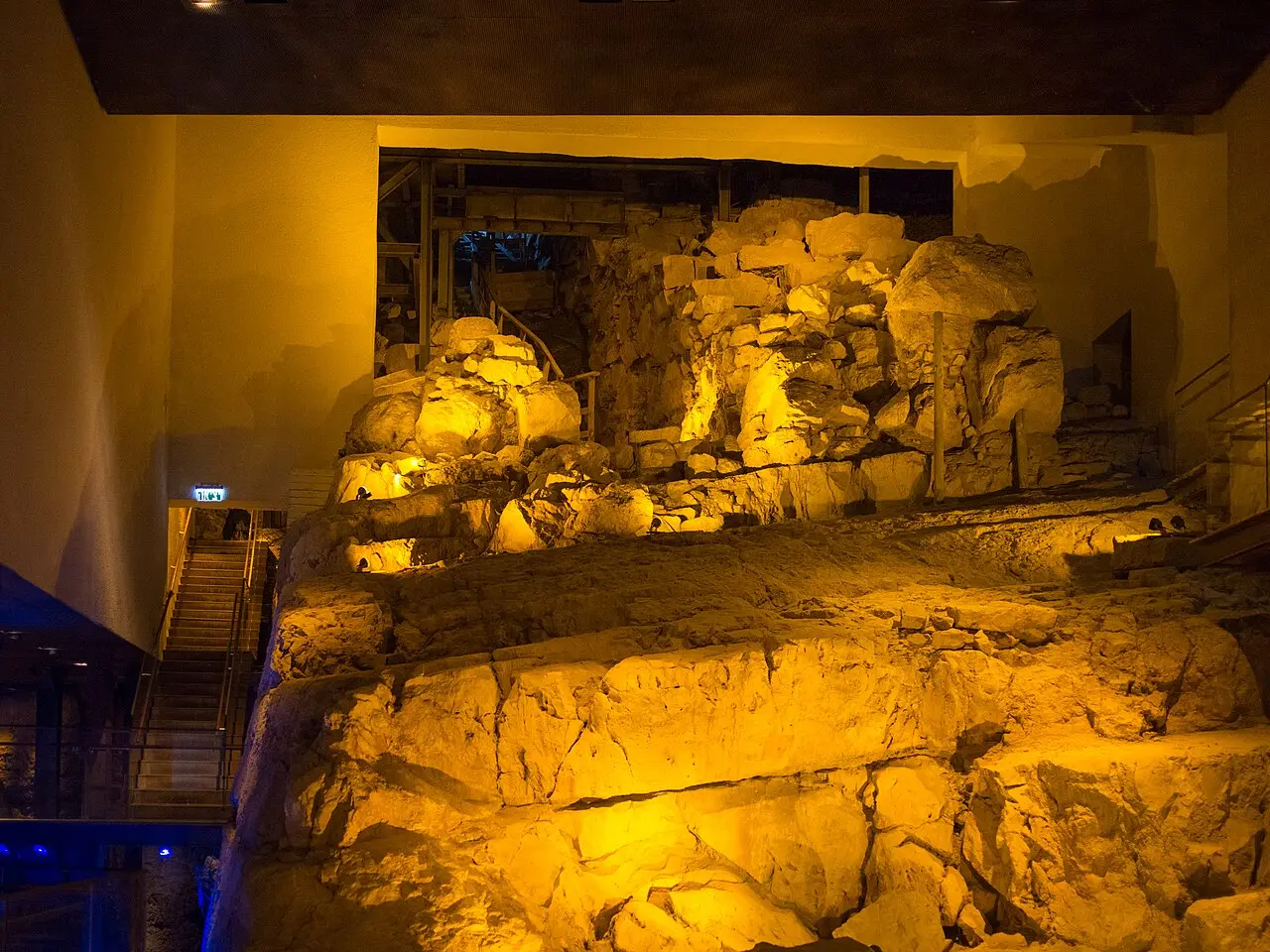 The massive stones of the tower that guarded the Gihon Spring, lit underground
