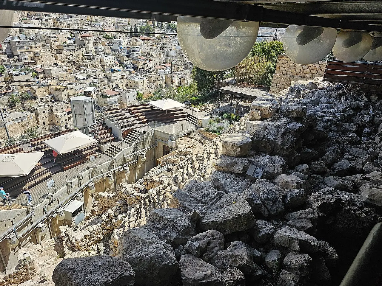 Excavations in the City of David with the houses of Silwan on the slope behind