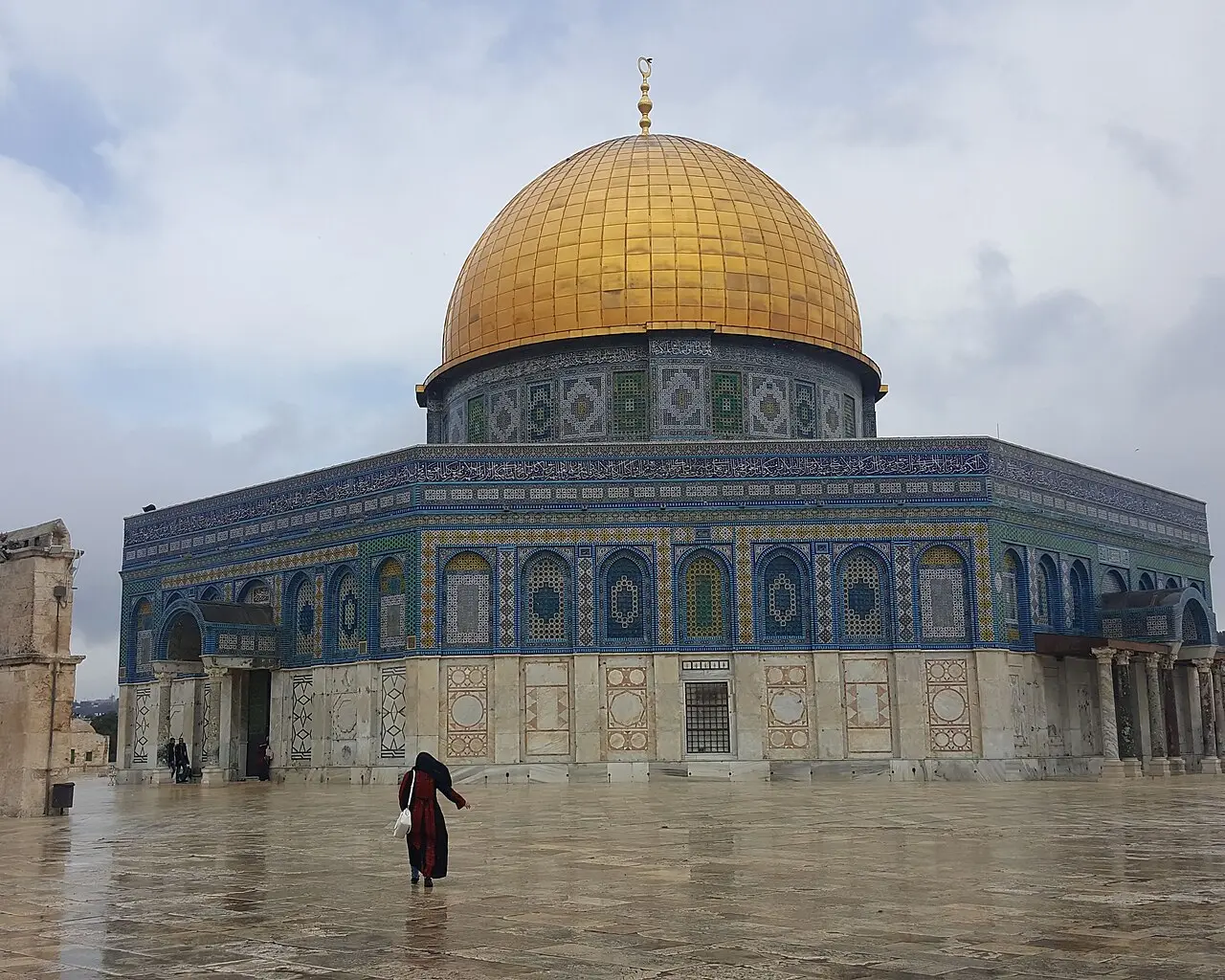 The Dome of the Rock on a wet day, its tiled walls under the gold dome