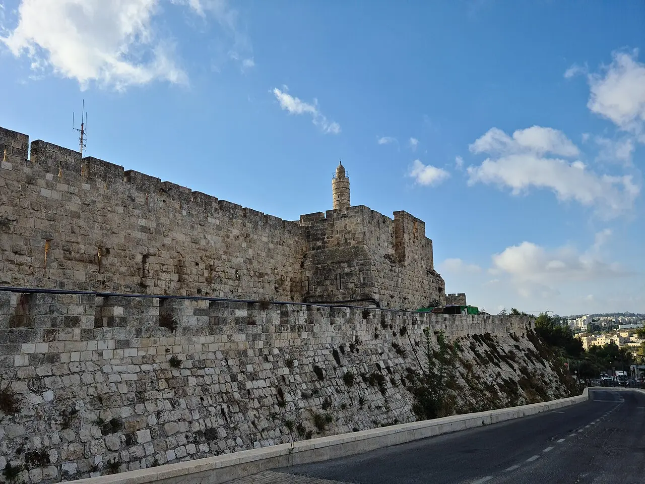 The citadel's outer wall and its minaret seen from the road below