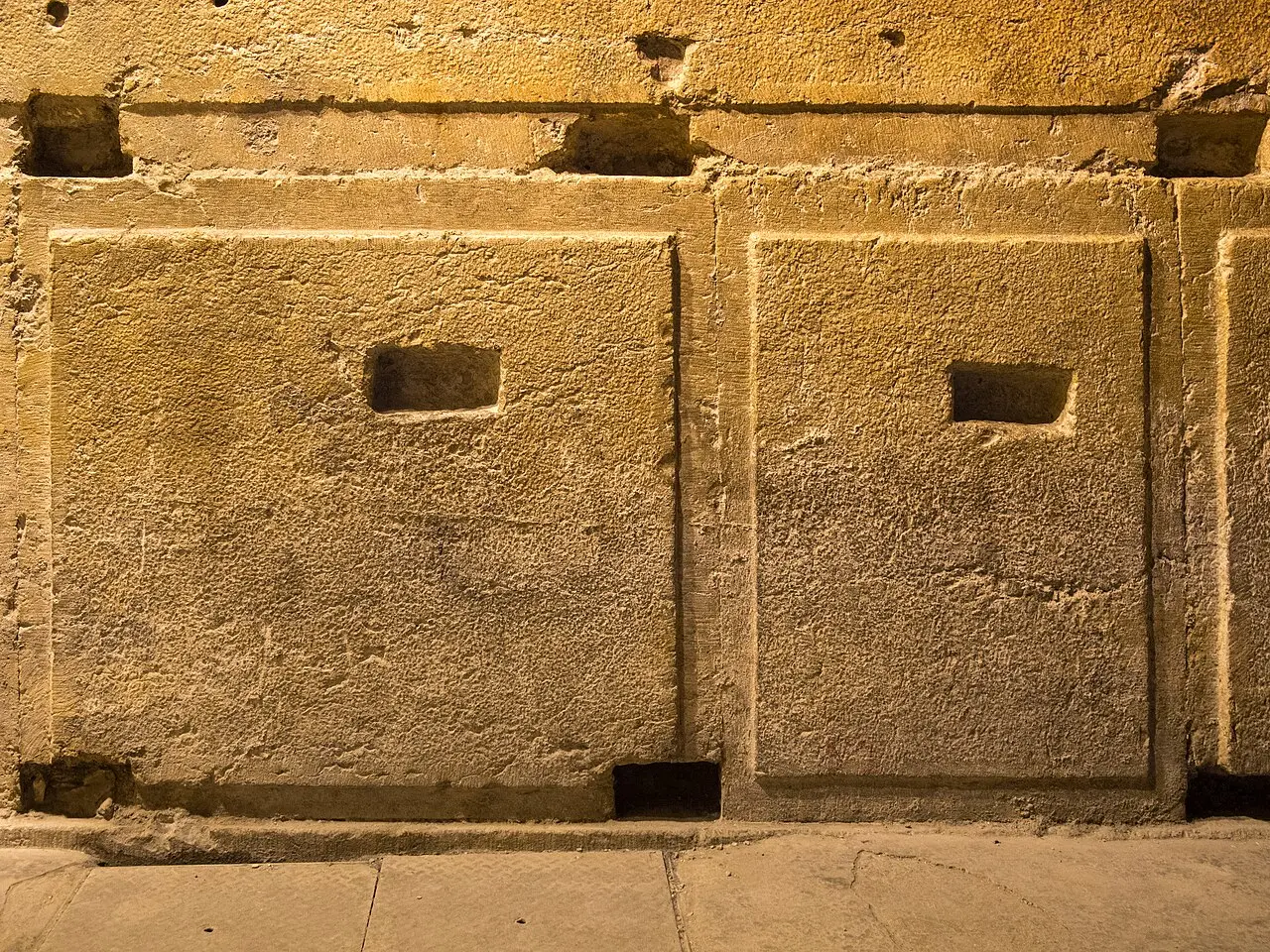 Enormous dressed blocks in the lower courses of the Western Wall, seen in the tunnel