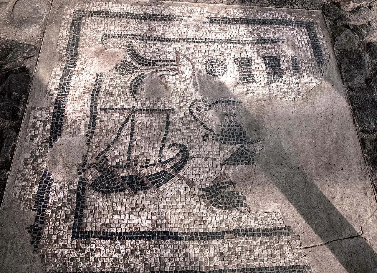 A black-and-white mosaic panel from the excavations at Magdala