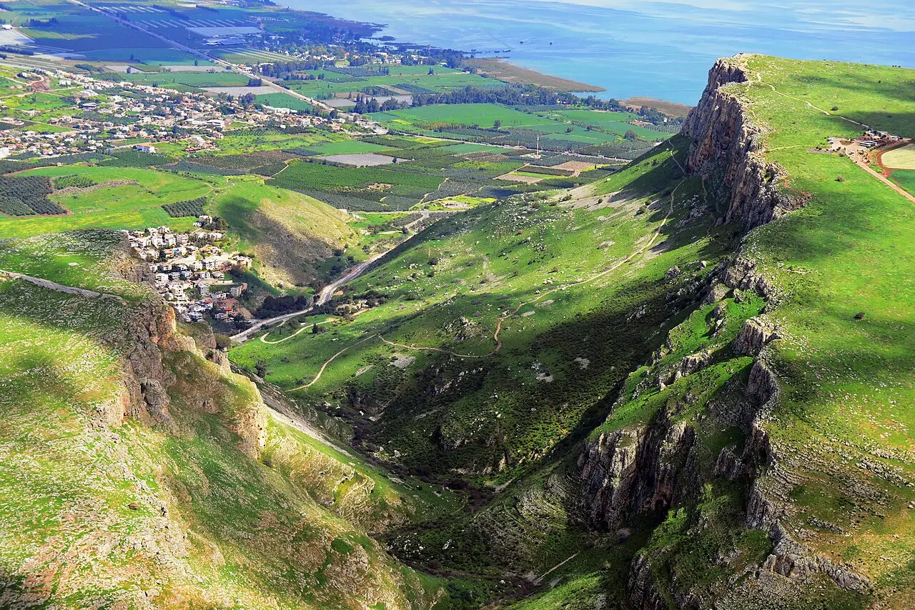 The cliff of Mount Arbel from the air, the Sea of Galilee beyond its edge