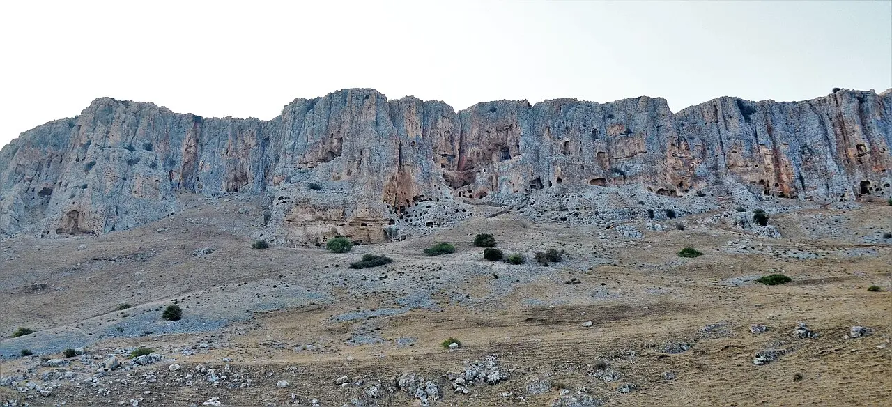 The cliff face of Mount Arbel, pocked with the mouths of its caves
